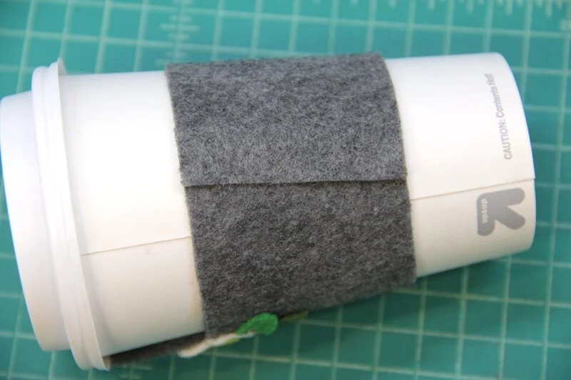 Llama coffee cozy wrapped around cup and glued