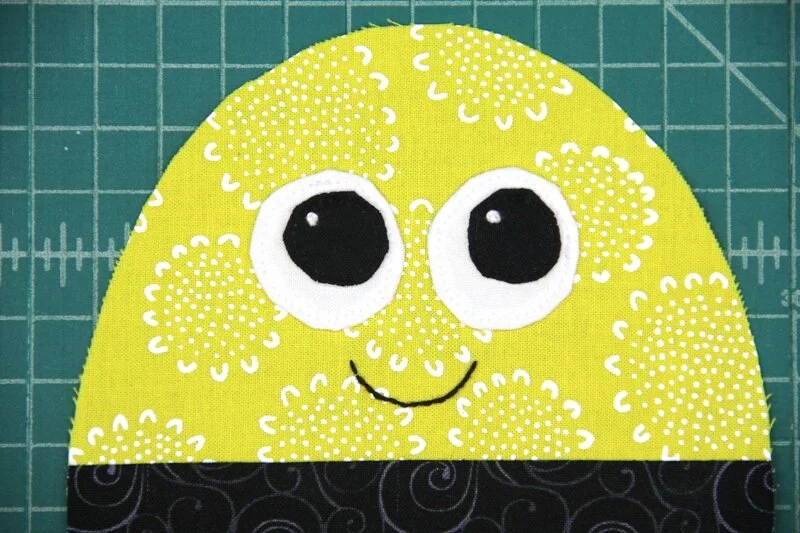 Irises sewn onto eyes