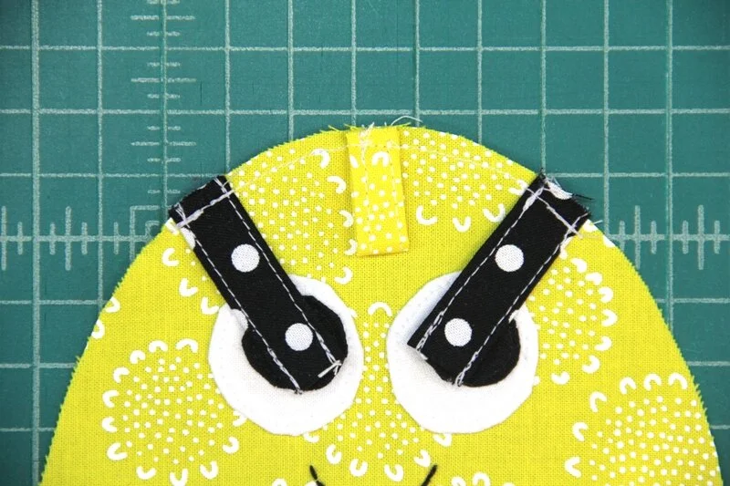 Hanging loop and antennae tacked to face