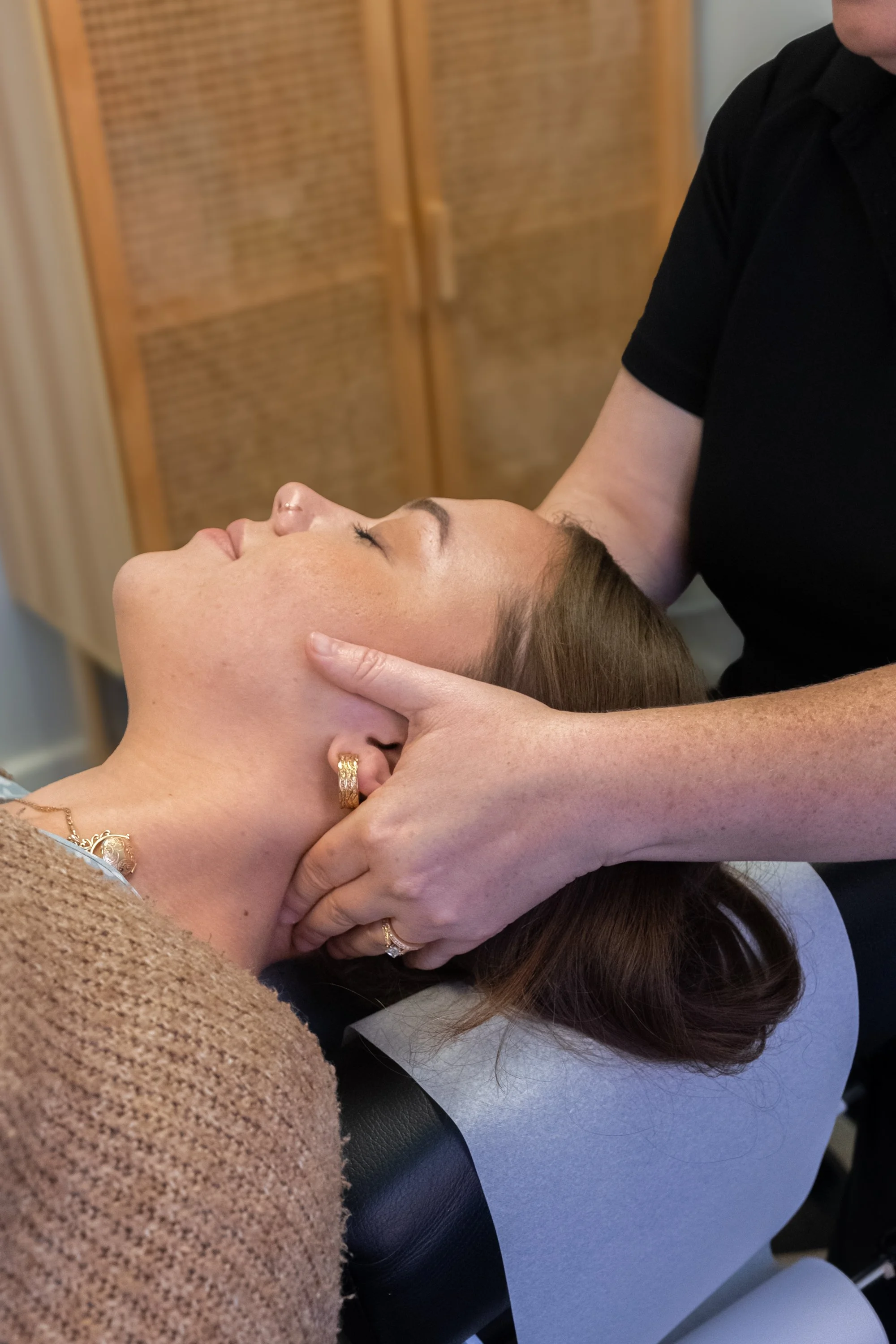 Manual Chiropractic Techniques hands gently adjusting a neck
