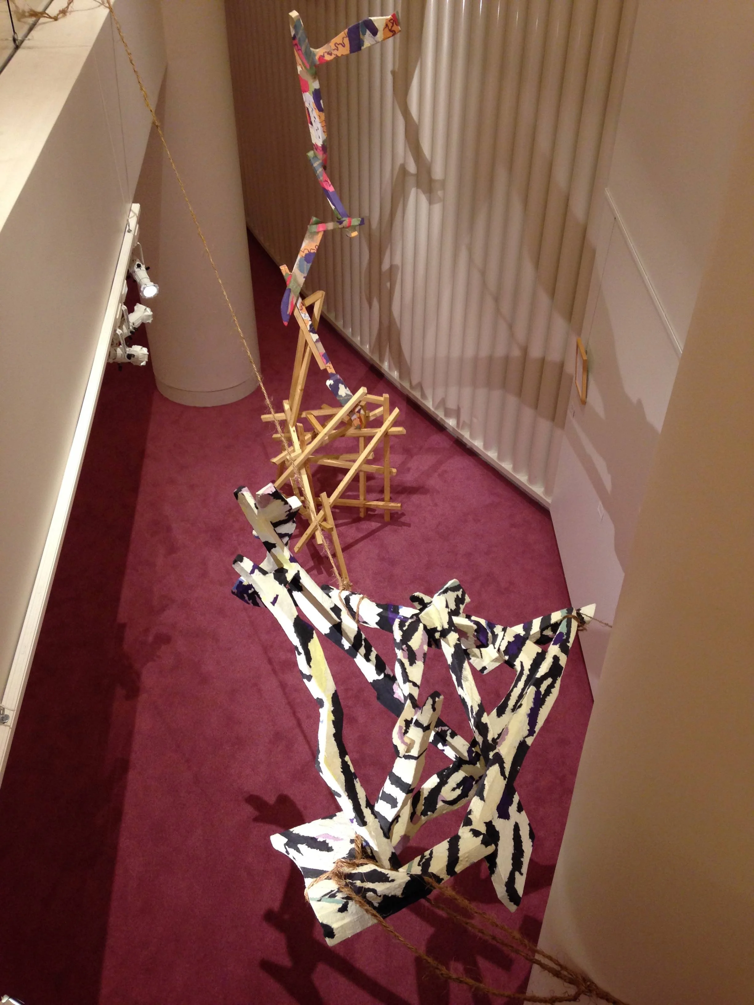 looking down from 2nd floor at Looking for God (lower piece) and How to speak reassuringly in always uncertain