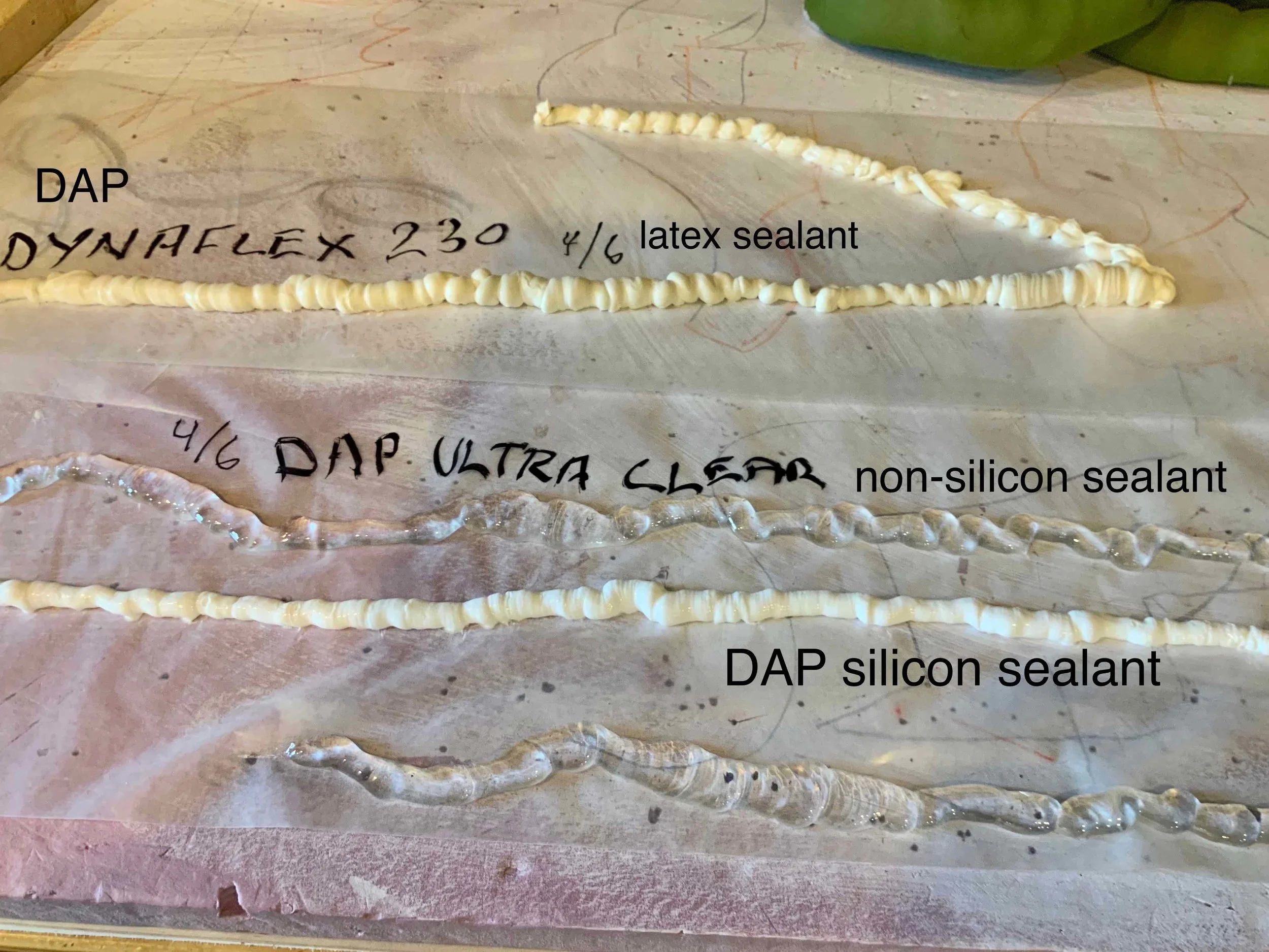 Next, we tried bathroom sealants as cores. Below the white DAP silicon sealant is another length of the DAP Ultra Clear. The Ultra Clear worked best for a couple of reasons. We could more easily squeeze out a wonky, fat then thin bead. When cured, it felt the strongest of the 3. The latex bead at its fattest never really felt fully cured and stayed squishy soft. It seemed weak.
