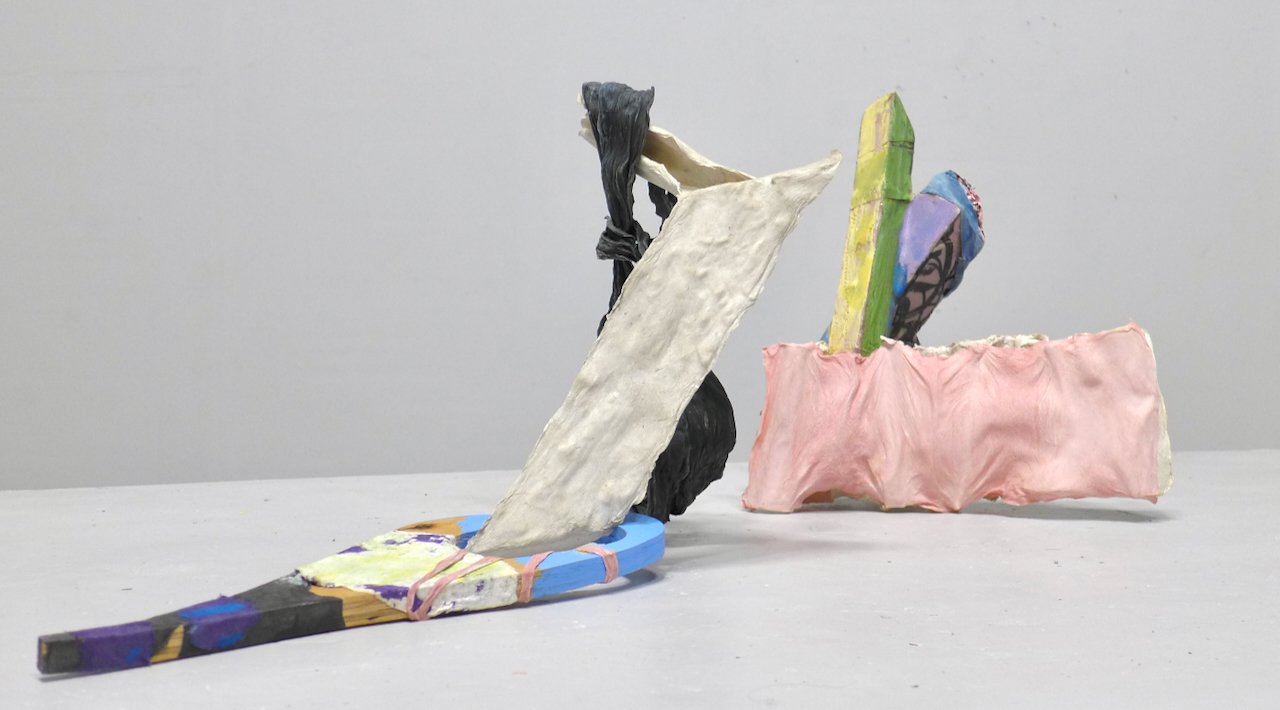 colorful tabletop composition using objects of mixed media