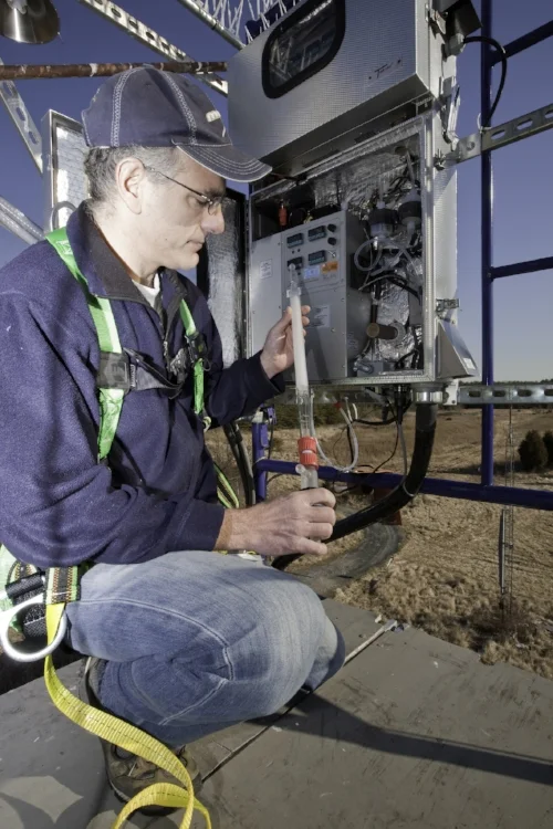 A NOAA Air Resources Laboratory technician works with the instrumentation system used to measure atmospheric mercury concentrations. Image taken in February, 2009 at the National Atmospheric Deposition Program's Atmospheric Mercury Network site in Beltsville, MD. Image courtesy of NOAA/ARL, via Flickr and used under a Creative Commons license .