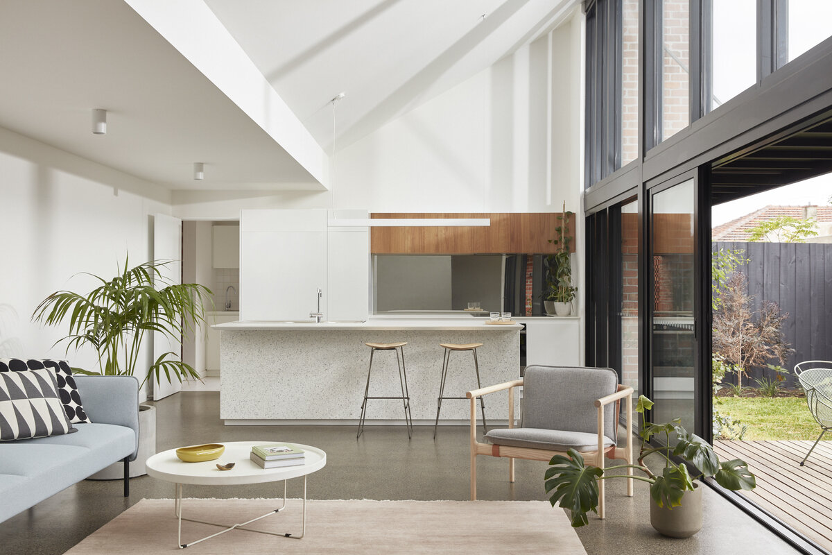 Image by Tom Ross. Furniture supplied by StyleCraft (Tom Skeehan Studio Hoshi Armchair and Hoshi Ottoman, Ross Gardam Adapt Lounge and Duet Barstools, Arper Pix Ottomans, Sipa Tommy Low Stool). Rug supplied by Armadillo & Co (Agra Rug in Duchess).