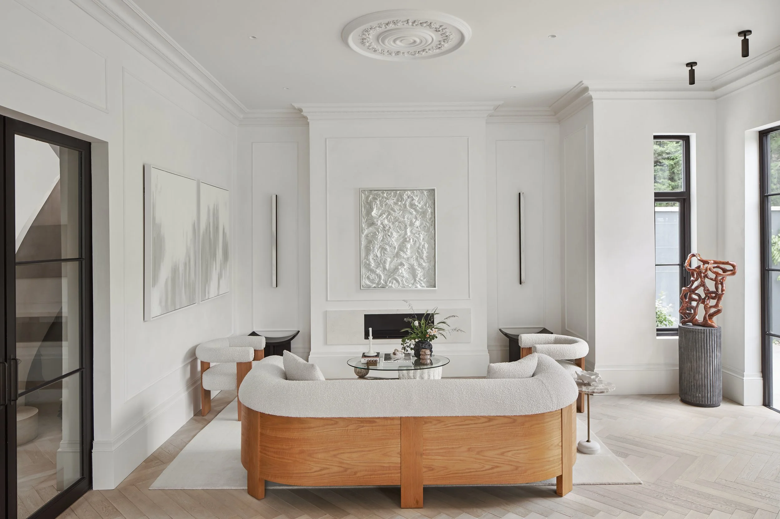 The restful living room features Chalk Bauwerk limewash walls, a bioethanol fireplace, and restored period features.