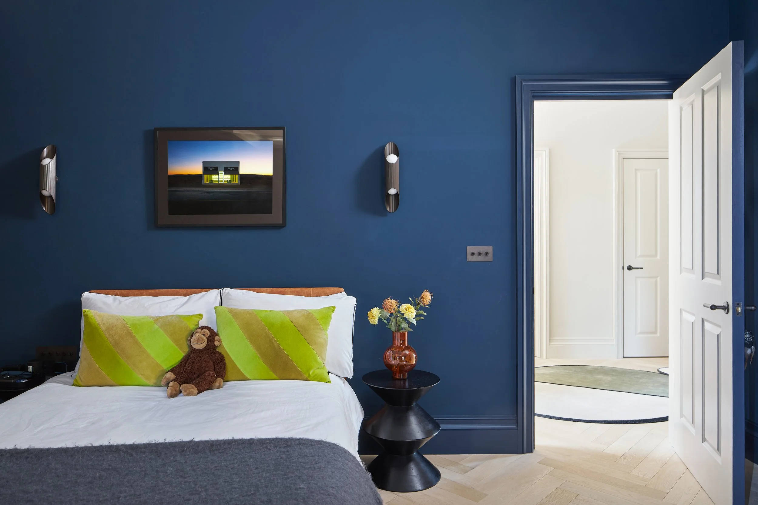 This deep blue room belongs to our clients' son. With citrine accessories to really pop.