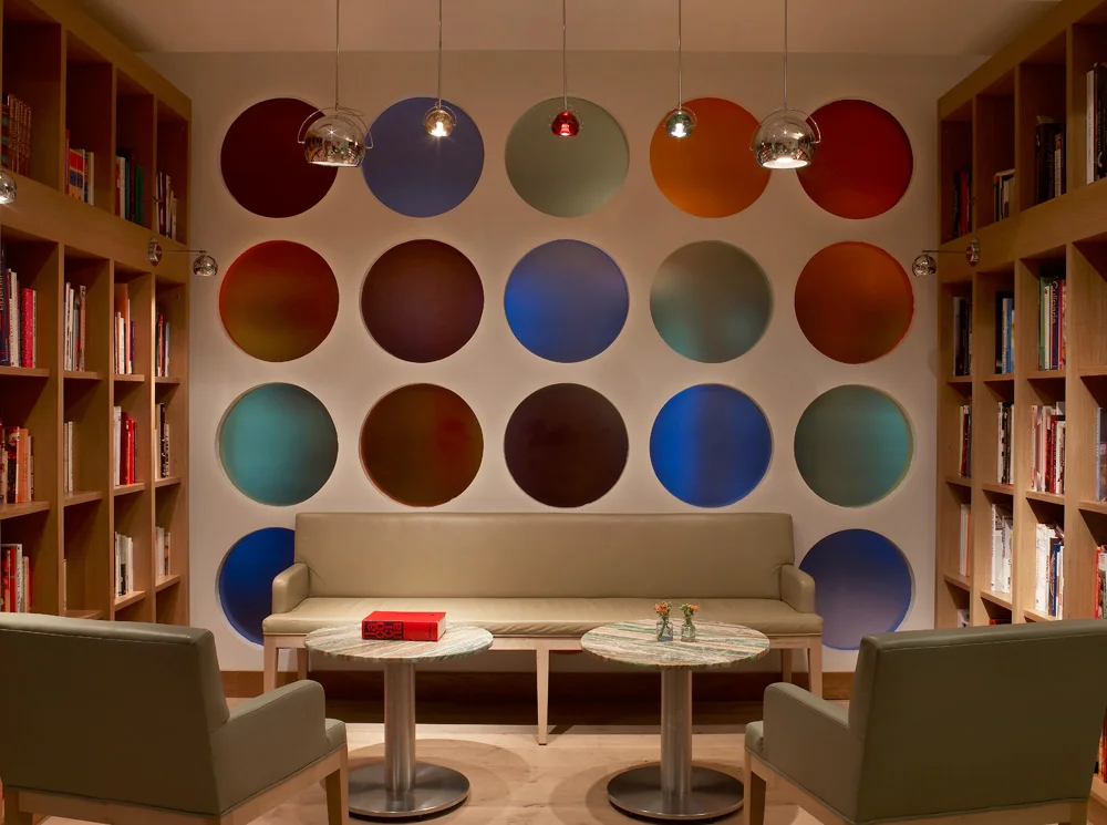 The Library room with colored glass display wall