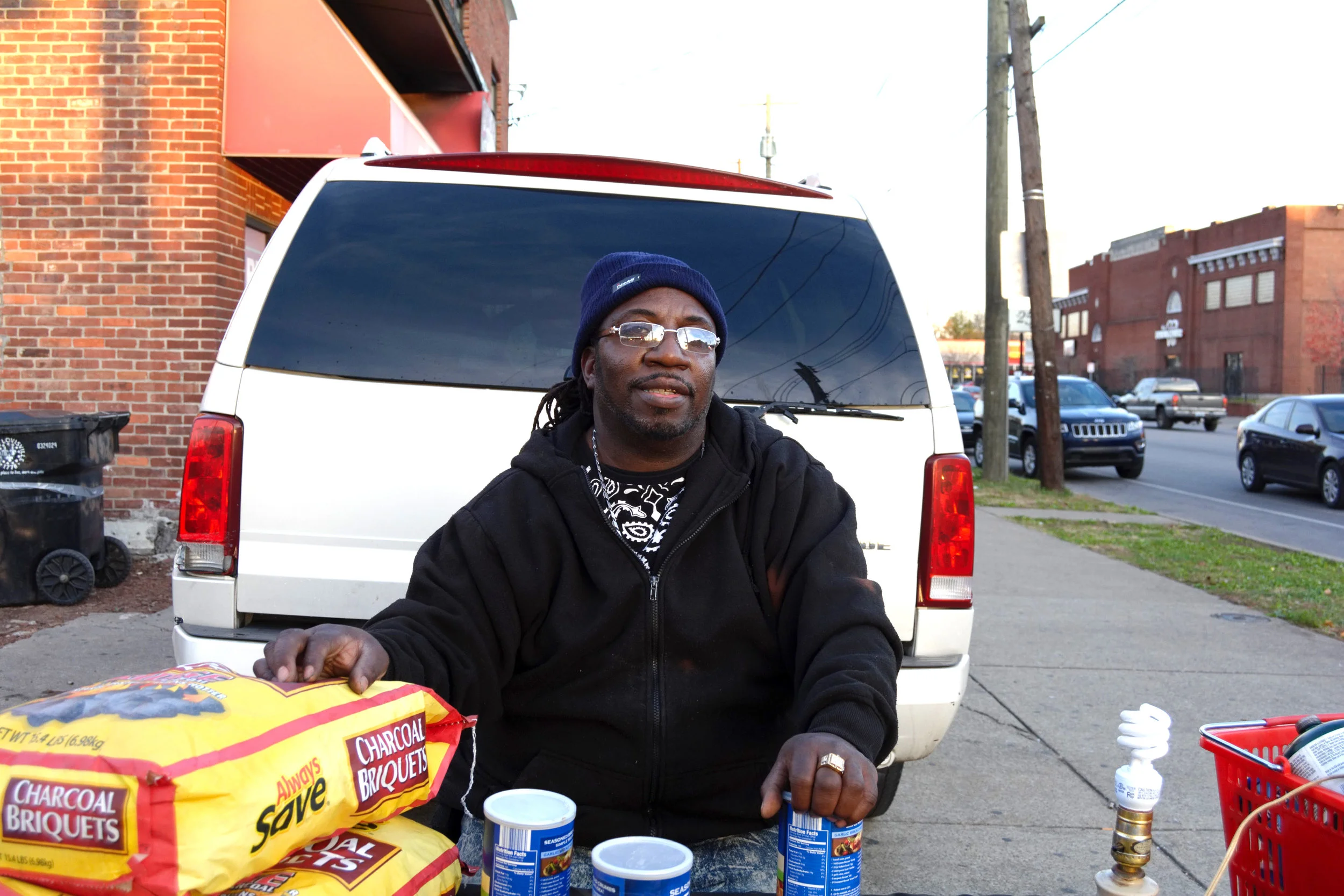 “I’ve been doing this for about thirty years but I’ve been here for two. This location is the one of the busiest locations in West Louisville. I always wanted to be in this spot and when the opportunity came, I took it. If I go, somebody else will snatch it. I’ve already built my clientele and I’m not trying to give up my clientele. I’m here for a reason. Eventually, I’m going to buy this lot and build. I gotta start somewhere and this is where I’m going to start. It might take another year or two to get to where I’m going but I’m going to get there. I live in the Highlands, I moved out of the West. I actually left the West End and moved to Atlanta. I lived there for about twenty years and came back. I’ve only been back in Louisville for about eight years. I had some ups and downs. I’ve been shot and robbed since I’ve been back. I was living a crazy lifestyle but I had to give it up. I have always been blessed with the skills to cook. I didn’t need anything else. People have to eat every single day and all I need is my skills. I’m just thankful for being here. When I wake up, I gotta give thanks. Sometimes, you have to bless somebody because you were blessed. I’m just thankful for the opportunity to bless others. If you pass it down, a lot of people might be in a better place than before. A lot of us can be selfish and being selfish won’t get you too far in life.” - Yaya (Owner of Yaya’s BBQ), Russell