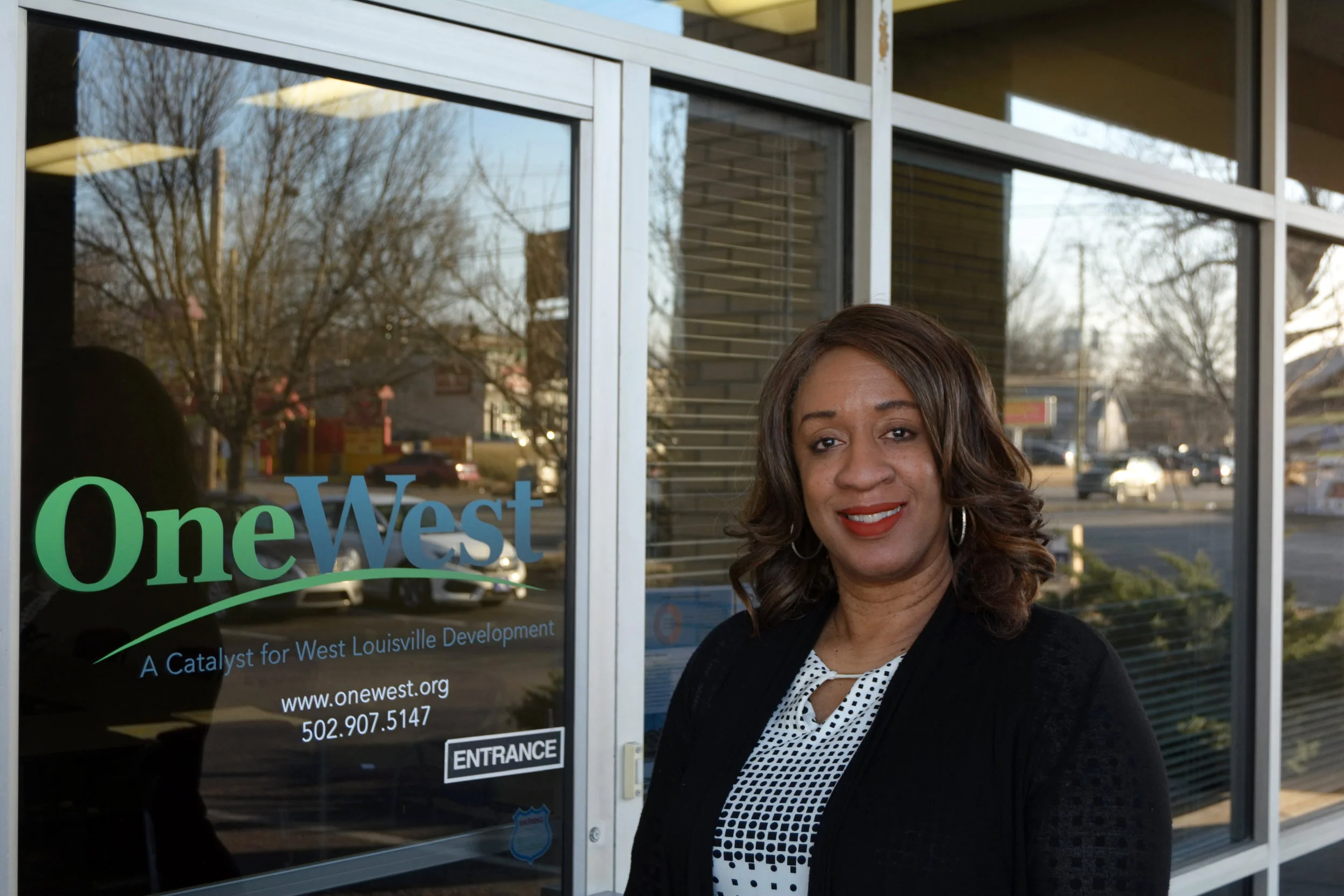 "We're focused on getting that dollar rotating within the community, so that people are able to be successful. We want people to have jobs and we want the retailers and commercial businesses to come, so that that there are local jobs for people within the community. We don't want to see a whole bunch of part time stuff, we want folks to get insulated with the right kind of jobs. We want to collaborate with housing developers and housing rehab programs to help people. We don't do housing but we want to help those that do to be successful. We want the community to get plugged in. If there's a way that we can help collaborative partners, we want to do that. One of the first things that you're going to see One West do is to get businesses to willingly participate in a program that will be hiring staff and will be on the street, cleaning up, every week. We want to clean up the trash in the streets. We're going to start on 12th & Broadway and go all the way up to Kroger. We want Kroger to get involved, as well. We're asking businesses who are willing to participate financially, as well as volunteerism. We want the community to participate, too. The hope is for this initiative to bleed into the side streets, where the businesses and the families in the homes can see that this is not what we do here and to say that trash in the streets is unacceptable. We want to engage the city to be a partner in this, and provide more rotation in trash pick up and supply more trash cans throughout the community. We think that this visible change, right off the bat, will restore the pride within the community. We want to get that investment in the area so we can begin to put these vacant and abandoned properties back into play and be able to attract retailers and grow and help grow home businesses that need a little help out the gate. This year, my goals are to help clean up the community and foster that collaboration with residents to clean it up. Second, we want to be a collaborative partner with projects and programs in neighborhoods that are moving forward with progressive value added development strategies. We're in a capital campaign that helps to fund any and everything that we want to do. So, we're asking for an investment from West Louisville and all around to help us to be able to do more. So we're out seeking investment to do more. With the YMCA and Passport coming, we want to continue to build on that momentum. We have some things underway, relative to real estate development, that we'll be announcing within the next couple of months. It's extremely important that West Louisvillians be involved. I have never seen community economic development go well whenever the community was not apart of it. Ownership is within the community. For-profit developers don't have to engage the community but community economic developers do. The Bingham Fellows Class of 2014, that started One West, were comprised of local leaders. Those leaders recognized that in order to effective in revitalizing the community, you had to have the community at the table. Our board is comprised of all people from all nine communities of West Louisville. Not only is it leaders from across the city but leaders from the neighborhoods. We've got folks representing the arts community, folks representing the residential community that are all serving on the board and leading the committees. For the first three years, One West focused on outreach to the community. They listened to what was important to the community on the different issues and concerns that they felt were of prominence. We made that our priority list. Another thing that we're very serious about is private investment because we don't want to be a 'here today, gone tomorrow' kind of business. We want to do what is going to be value added with a long term strategy. We need a long term strategy with all of the challenges that we have. With that, every time we have a win or success, we are going to celebrate that and help promote what's happening. It's going to be one initiative at a time and it going to require patient money, that's going to help us reach the long term goals." - Evon, President & CEO of One West, California