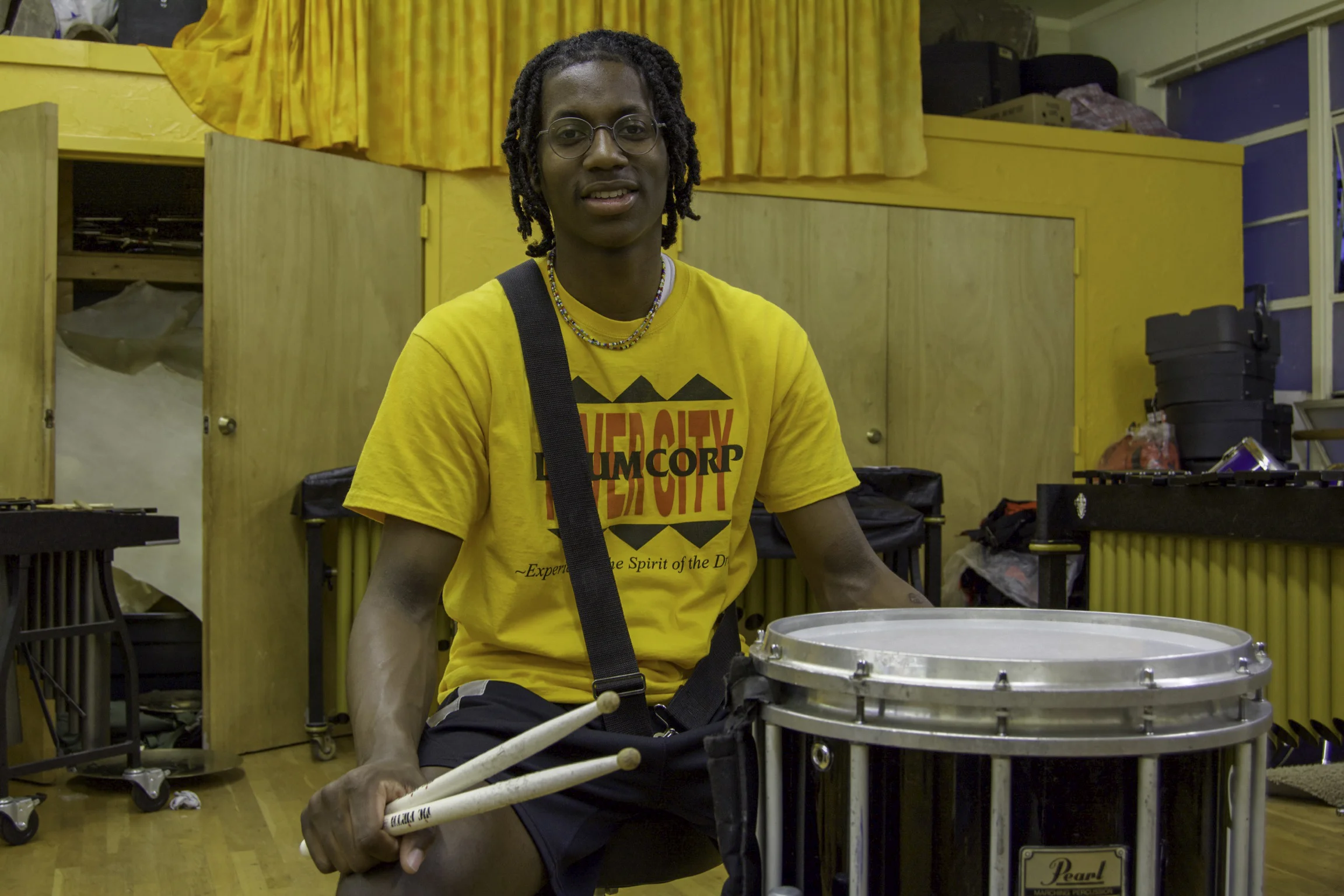 “I’ve been here for fourteen years. I was four and I’m eighteen now. The River City Drum Corp. has made me a totally different person than what I would have been. I’m more responsible and better at getting stuff done. I know that real life has consequences and there are rewards to good things that you do. It taught me how to be an adult. The biggest lesson that I take from RCDC is that if I don’t get my stuff done, I won’t be able to have fun. It’s all about responsibility. Drumming is my passion, it’s what I do. If I was to drop everything and forced to choose one thing, it would be drumming. I’m just naturally good at it and it’s what I love to do. I get to reach others through it. I get to teach all the kids and the older kids and make people smile. I wanna make people smile and dance. We’re just doing good stuff over here, especially with the drums. What’s next? I’m going to college. I want to go to Tennessee State University. Hopefully, I’ll get to play there. I’m waiting to hear back about scholarship stuff. I’m going to get my degree in aeronautical and industrial technology. It has to do with aviation and airplanes. As far as drumming, I won’t do it professionally but I will definitely come back to Drum Corp. to help teach the younger kids coming up and make them better. I want all of them to be better than me and they can come back and teach and keep it going. That’s what somebody did with me. Alumni came back and taught me so much stuff that I didn’t even know. I plan on going to TSU and learn new stuff and will come back and help make the kids better, so they can make somebody else better. Whatever you want to do, if you really want to do it, don’t give up. It doesn’t matter how long it takes or how hard it is, you have to keep going. If you really want to do it, just keep trying. If you want to do it, you’ll it. Don’t say you can’t do it. Tell yourself that you can and practice at it. Remember that it takes time to accomplish stuff, so don’t give up.” - Jaylen, Louisville River City Drum Corp in Park DuValle