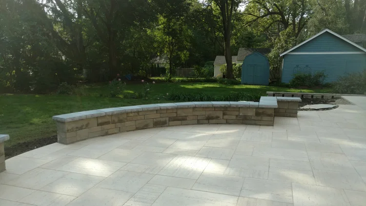 Patio-redesign - Libertyville, IL
Normal.dotm
0
0
1
28
160
Florida State University
1
1
196
12.0
0
false
18 pt
18 pt
0
0
false
false
false
/* Style Definitions */
table.MsoNormalTable
{mso-style-name:"Table Normal";
mso-tstyle-rowband-size:0;
mso-tstyle-colband-size:0;
mso-style-noshow:yes;
mso-style-parent:"";
mso-padding-alt:0in 5.4pt 0in 5.4pt;
mso-para-margin:0in;
mso-para-margin-bottom:.0001pt;
mso-pagination:widow-orphan;
font-size:12.0pt;
font-family:"Times New Roman";
mso-ascii-font-family:Cambria;
mso-ascii-theme-font:minor-latin;
mso-fareast-font-family:"Times New Roman";
mso-fareast-theme-font:minor-fareast;
mso-hansi-font-family:Cambria;
mso-hansi-theme-font:minor-latin;
mso-bidi-font-family:"Times New Roman";
mso-bidi-theme-font:minor-bidi;}
Believe it or not this particular patio have man made slabs as the patio surface. The ivory color Travertina from techno-bloc made the large surface area look less busy with longer joint lines. 