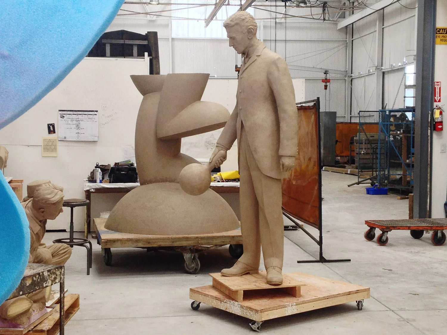 Full sized clay Nikola Tesla in the mold-making room at Artworks Foundry in Berkeley California ready to get it's mold the first step in the lost wax casting process. 