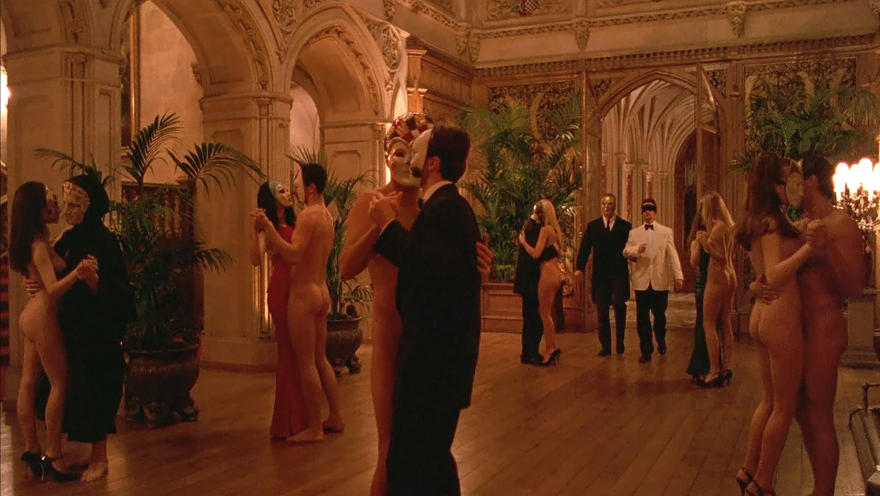 Mansion ballroom dance scene with Nick Nightingale (Todd Field) blindfolded, in Eyes Wide Shut (1999)