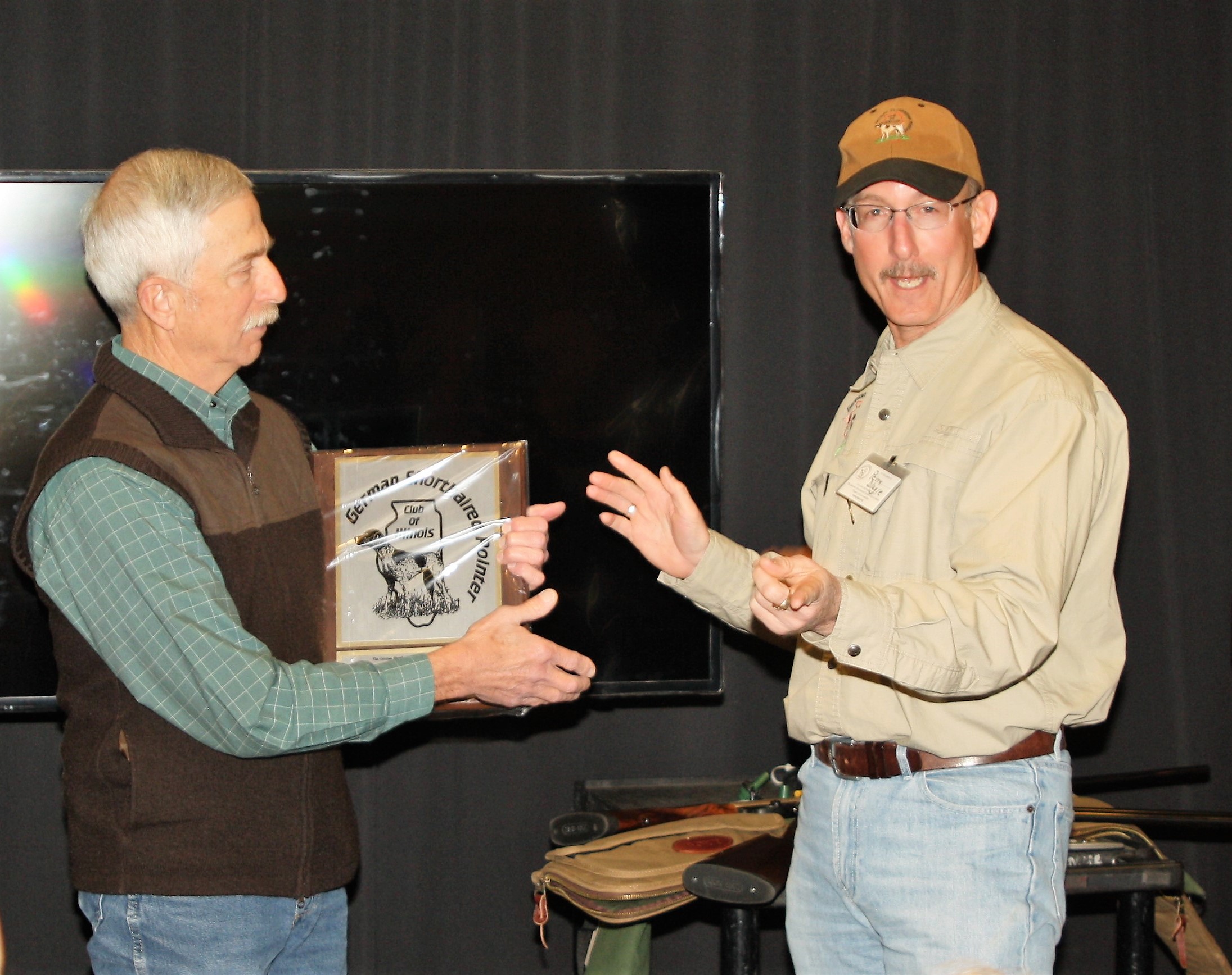 President Perry Dlugie presenting Terry Musser with GSPCI plaque for his service.
