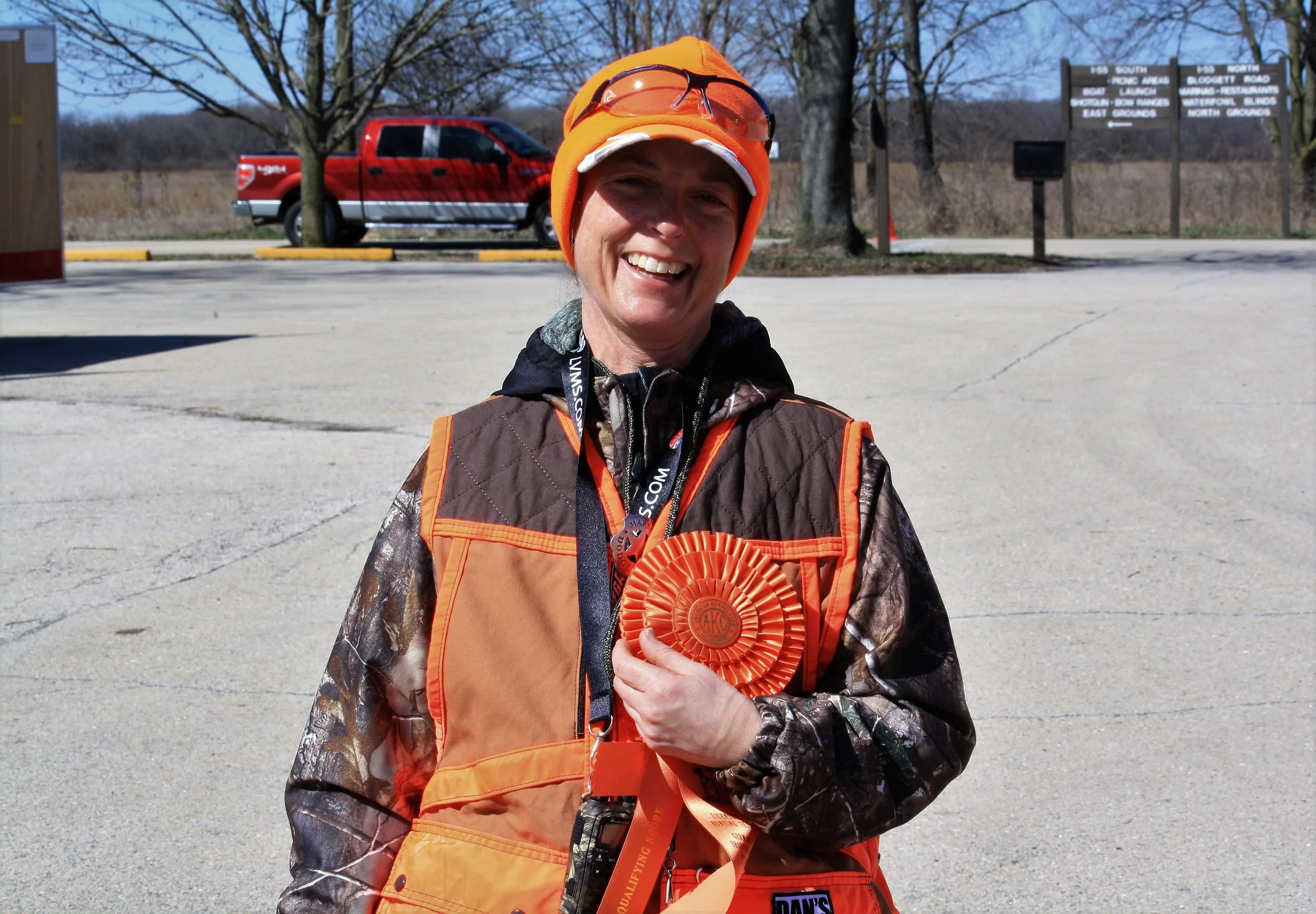 First time handler with a AKC hunting test pass ribbon
