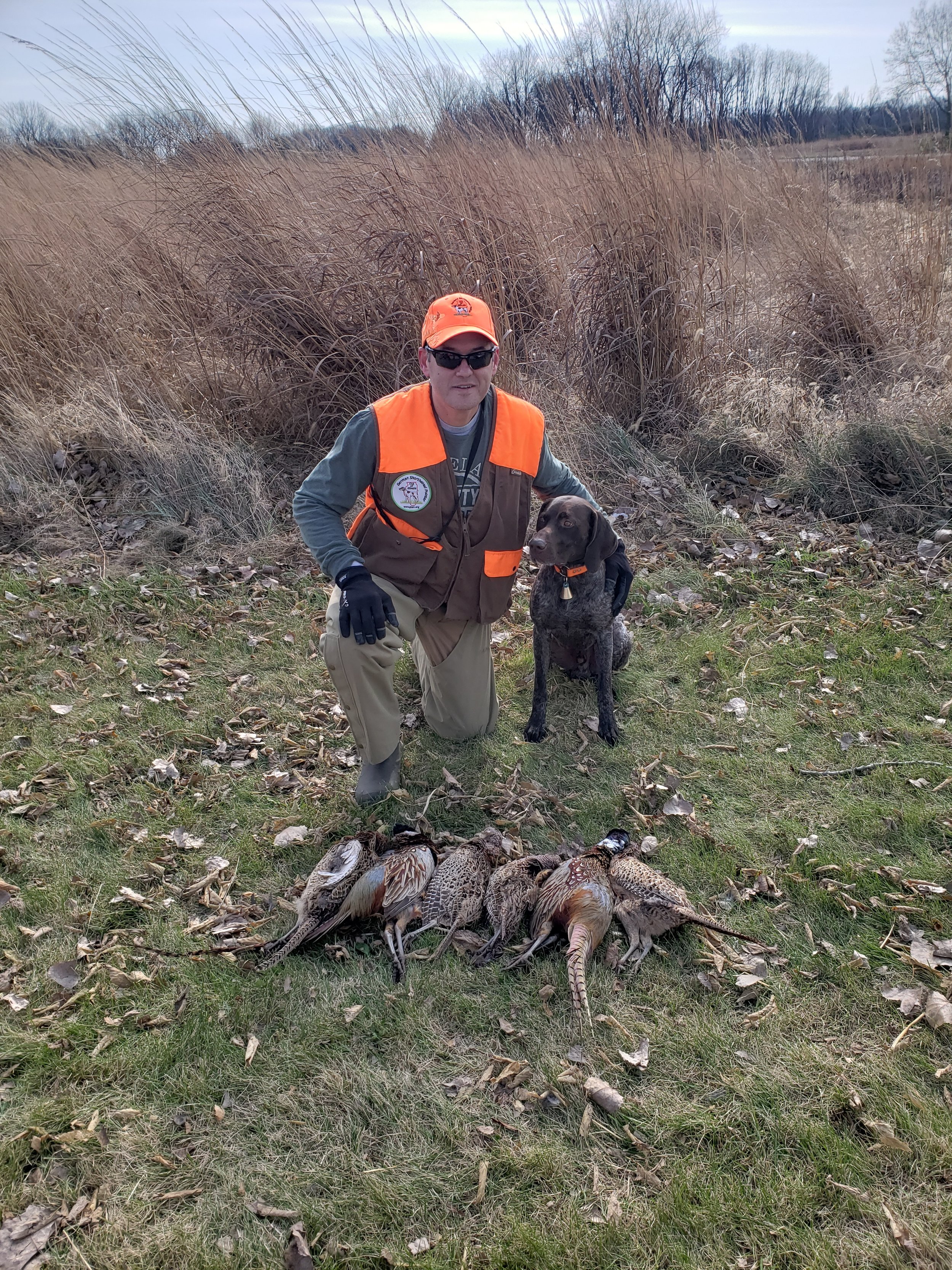 Ivan with his dog Ronnie and 3 man limit of pheasants