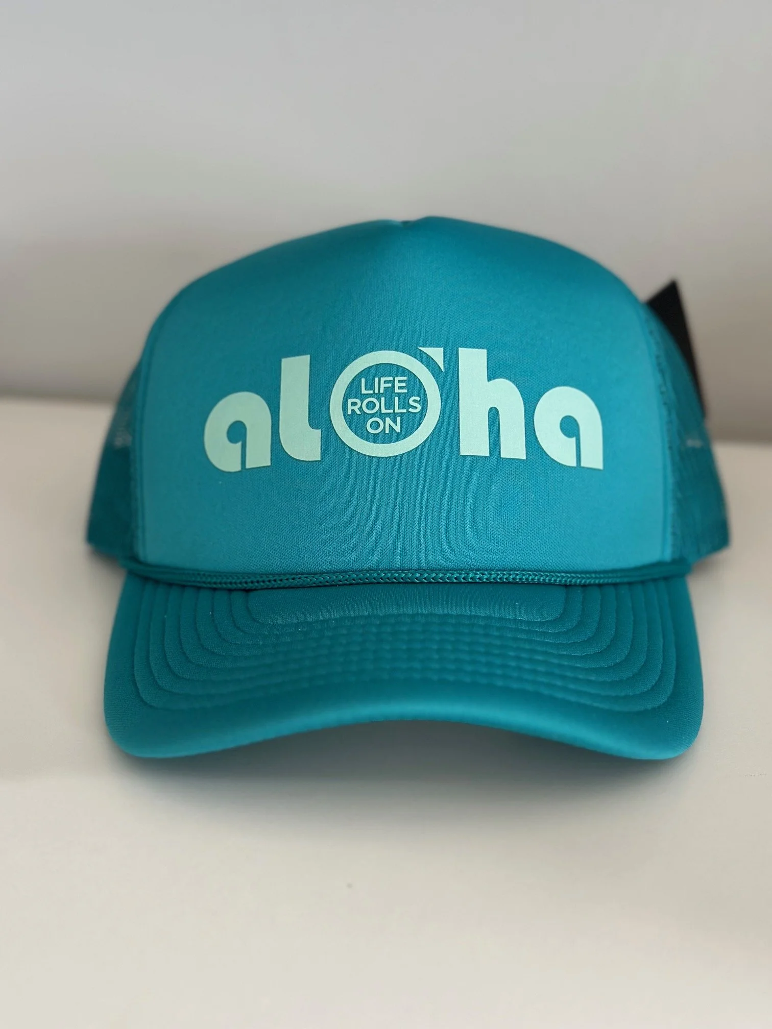 teal hat front.jpeg