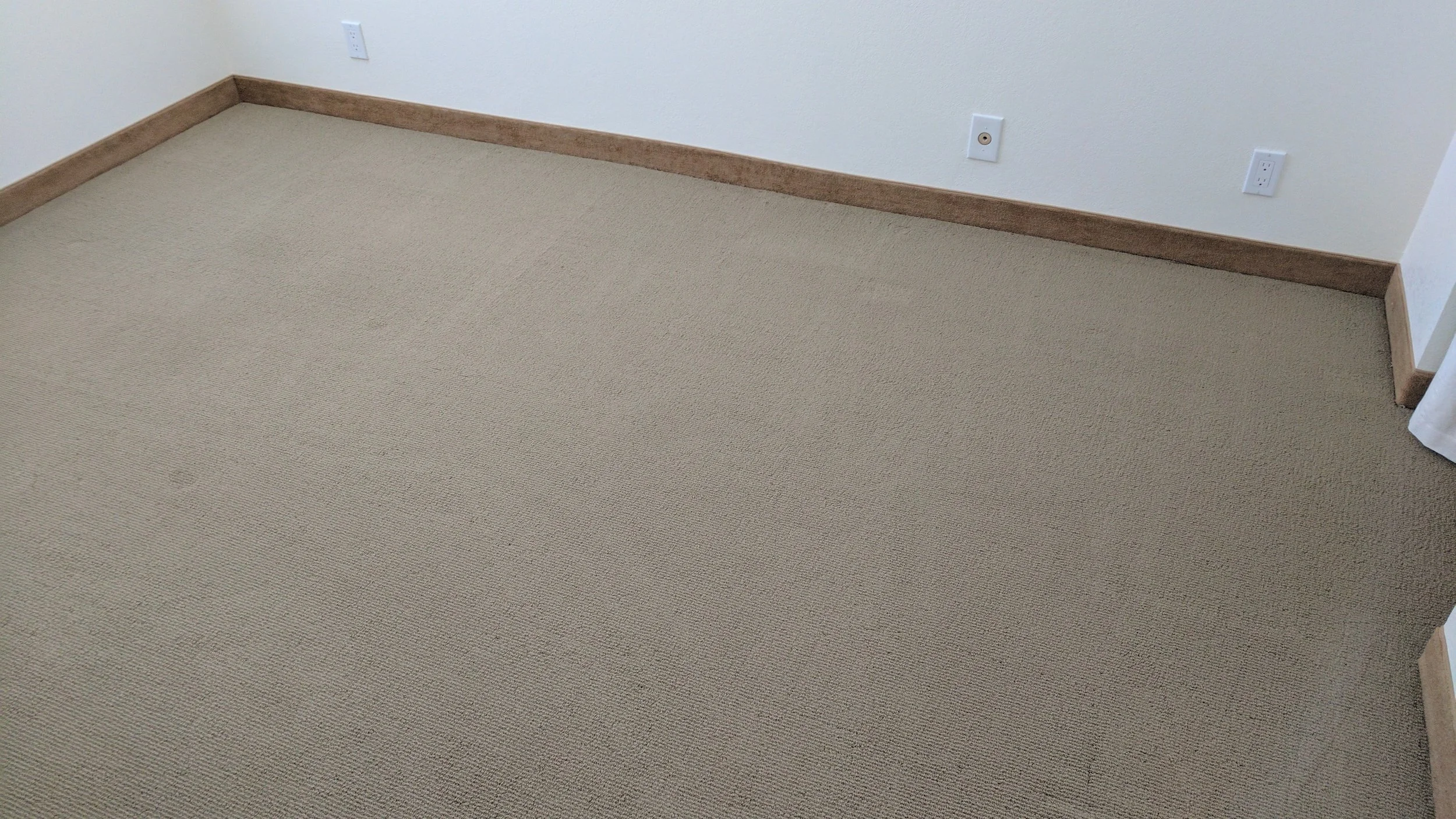 After power-stretching, the seam is 100% invisible. The homeowner saved thousands of dollars by avoiding a total carpet replacement.