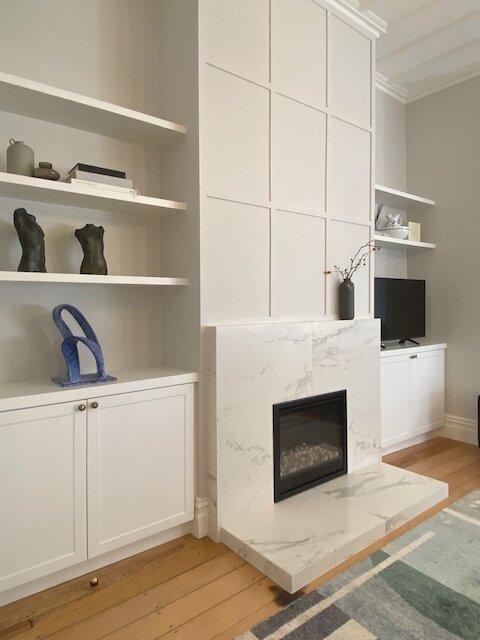 The completed fireplace and cabinetry
