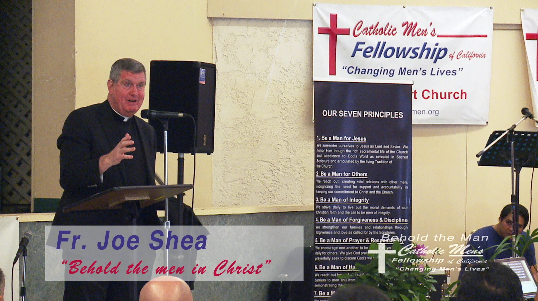 WEB Father Joe Shea speaking.jpg
