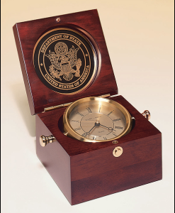 Captains Clock Captain's clock in hand-rubbed mahogany-finish case, solid brass clock housing. Price of $268.00 does not include engraving. Engraving is the greater of $24 or 30¢ per character. Overall size is 5½ x 5½ x 3¾. Lifetime guaranteed movement