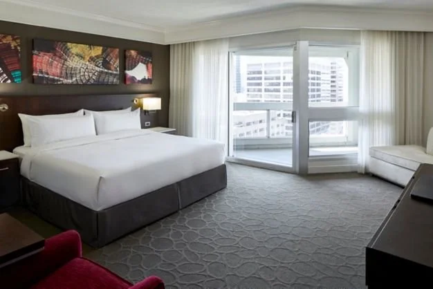 a hotel room with one bed.