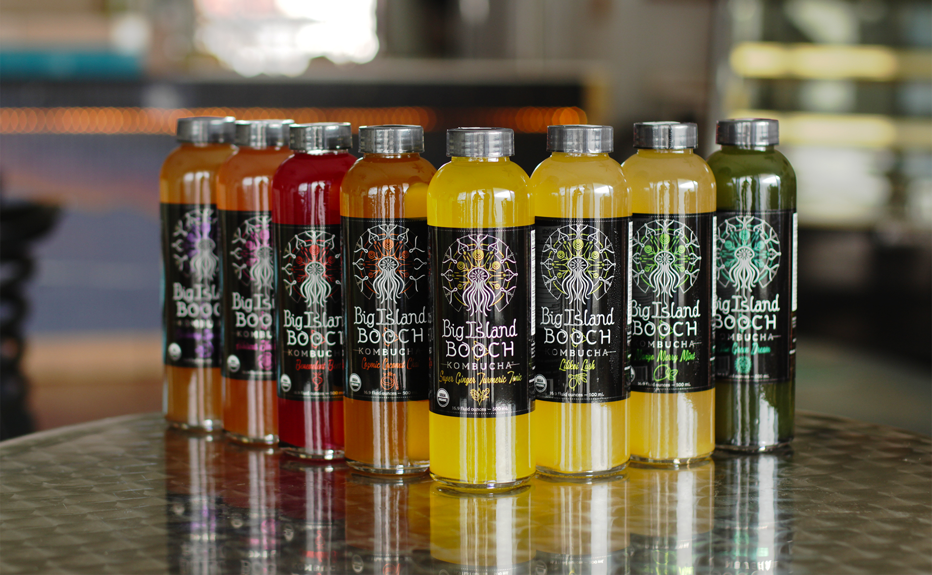 The rebranding was multi-faceted. Labels were completely revamped, a newly-shaped custom glass bottle was introduced, and a fresh USDA Organic seal of certification now adorns the products. We launched with 8 initial kombucha products. Labels were printed on metallic material, giving a great elemental feel and dynamic pop to each flavor color and accent graphics.