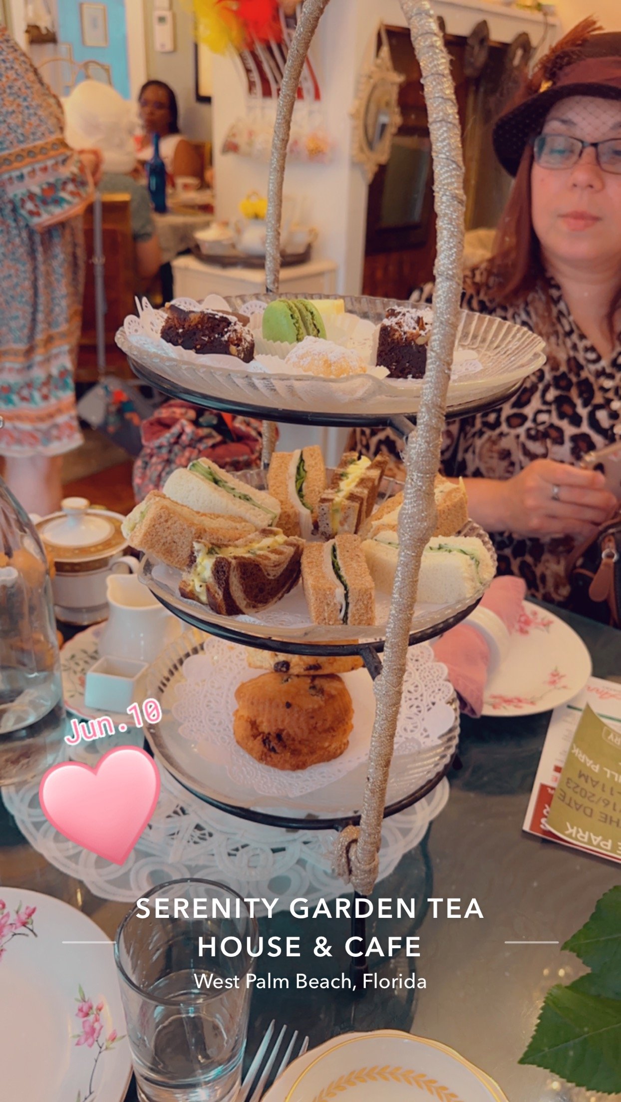 Shirley and the three tiers of goodies at tea on 06-10-23.jpg