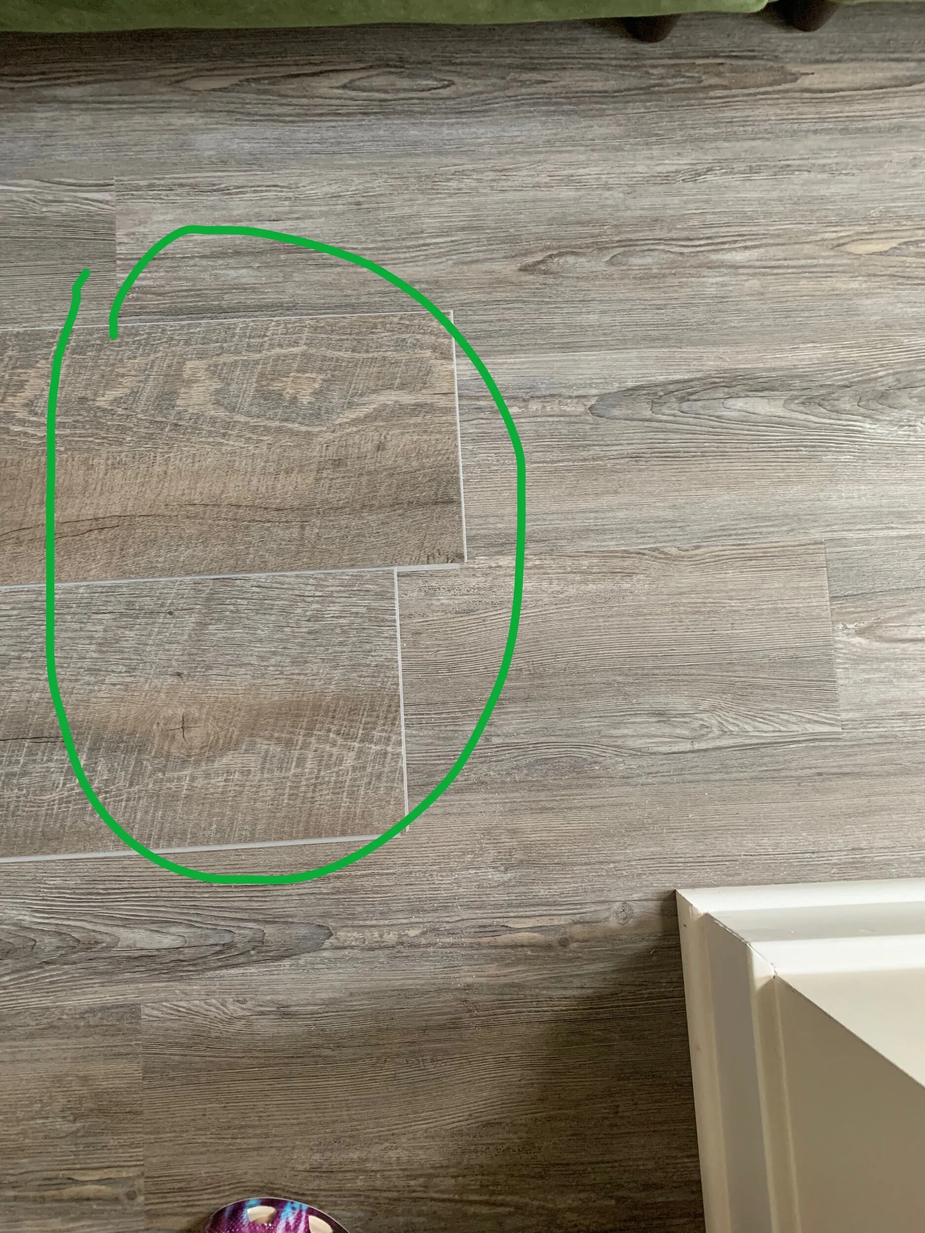  two of the new planks on top of my downstairs flooring 
