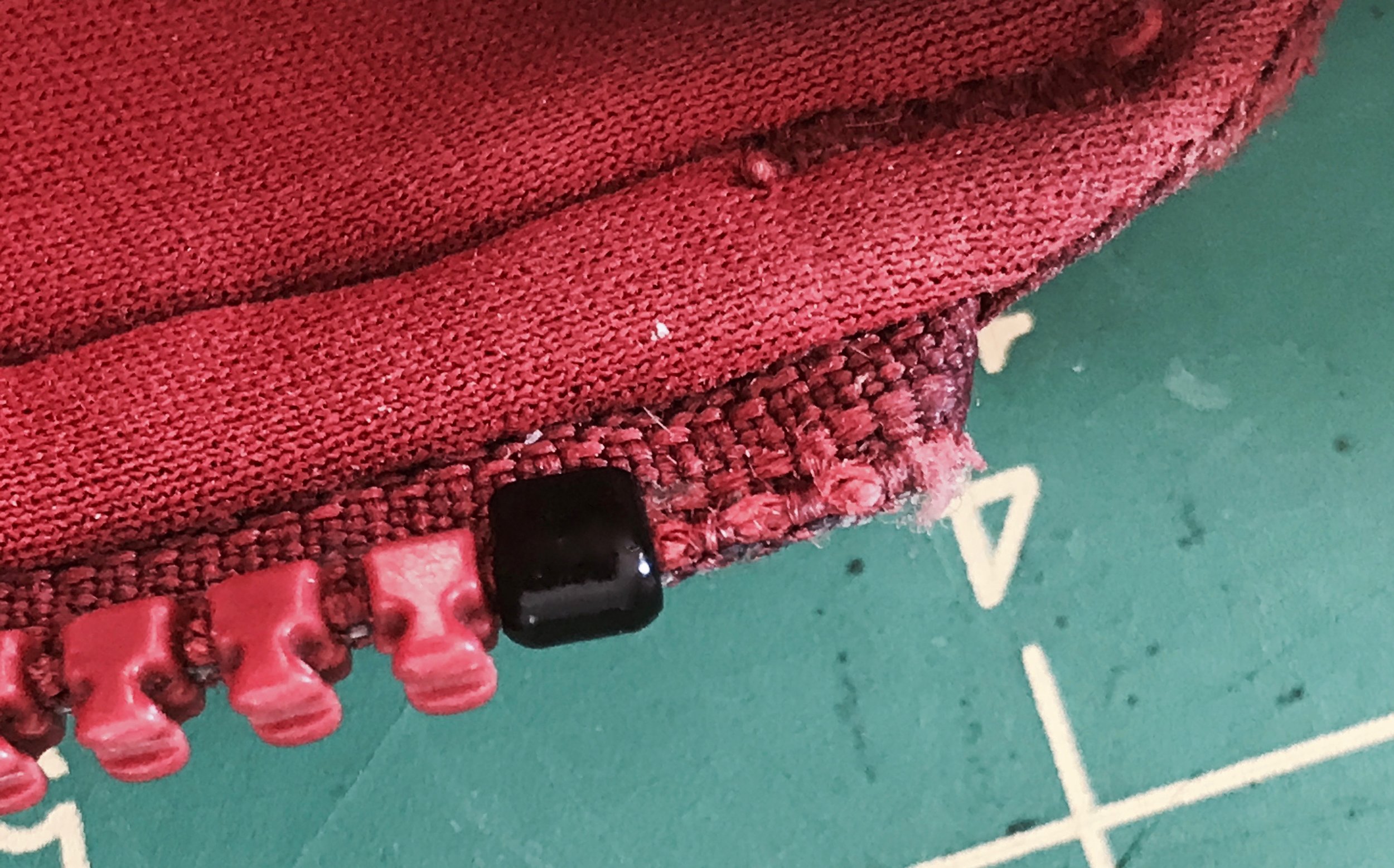 A new top stop will keep the replacement slider on the zipper chain.