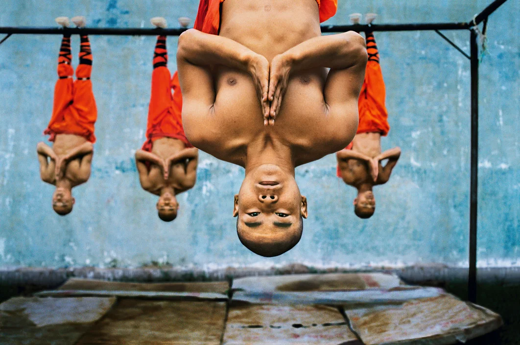 steve McCurry, shaolin monks hanging.jpg