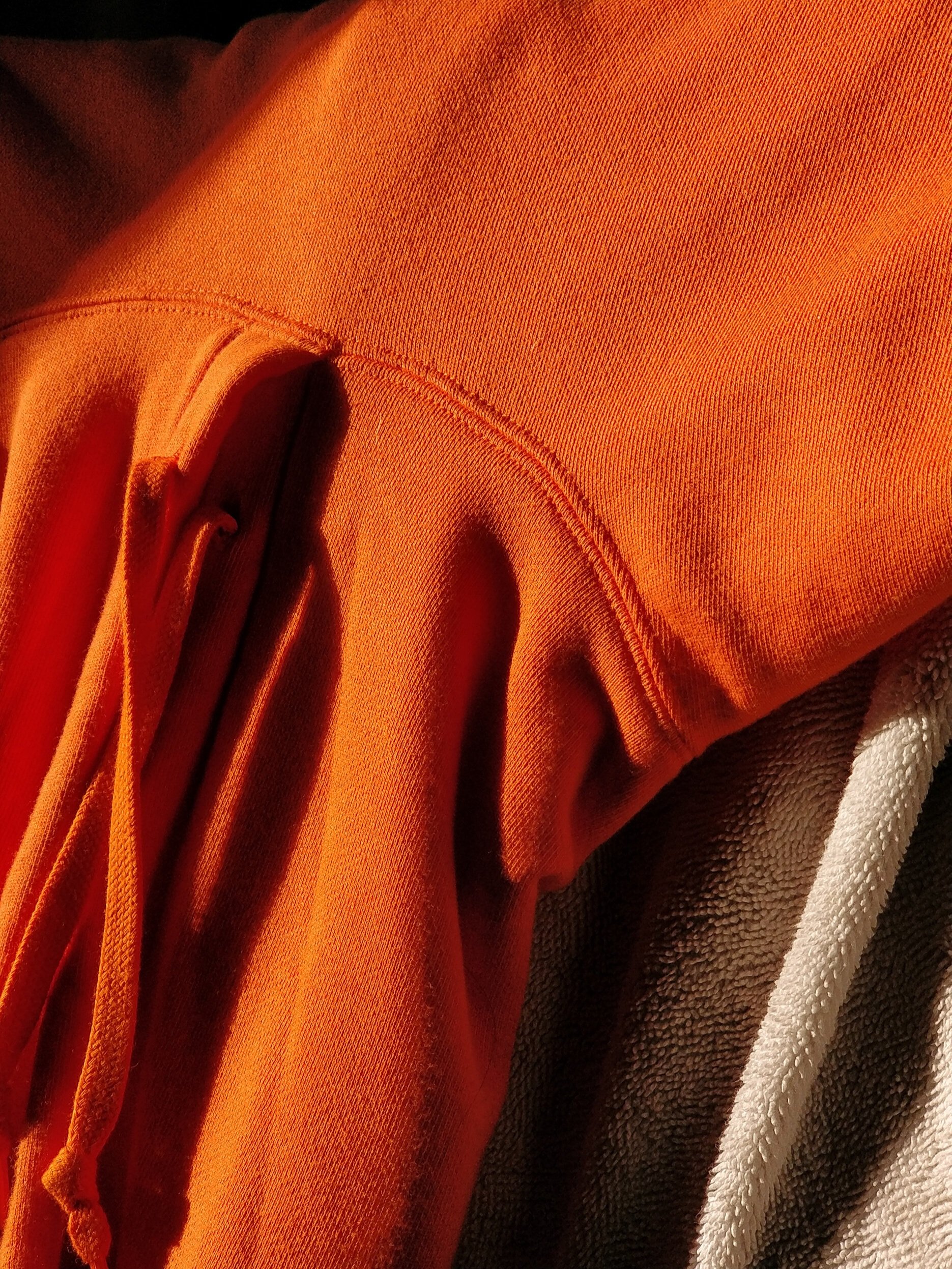 objects #24, orange hoodie