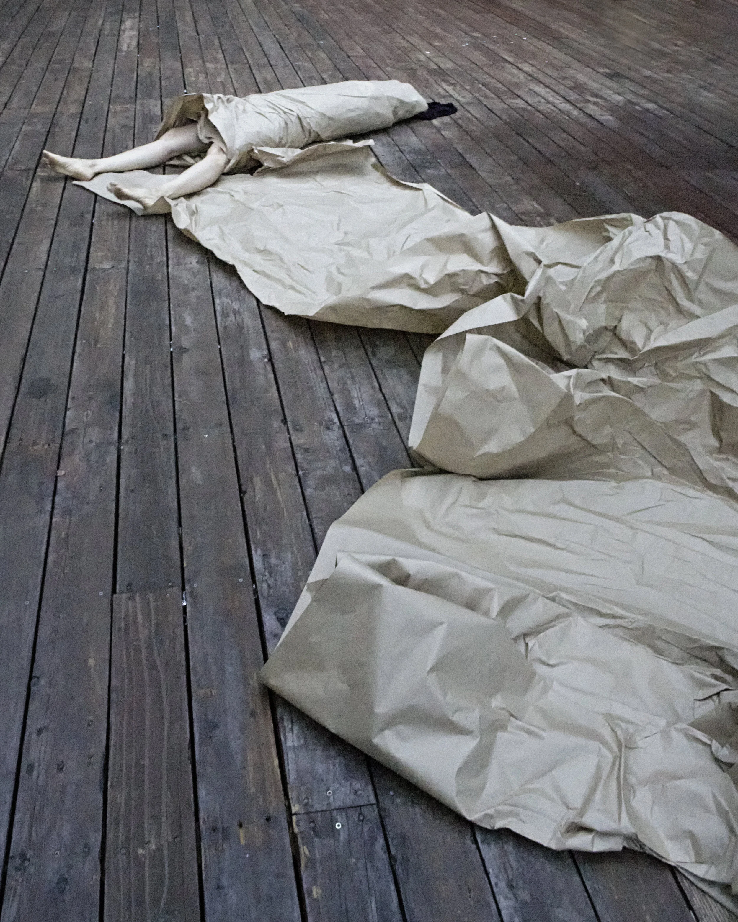 Janine Antoni in collaboration with Anna Halprin, Paper Dance , 2013. Rehearsal photographed by Pak Han at the Halprin Dance Deck © Janine Antoni; Courtesy of the artist and Luhring Augustine, New York