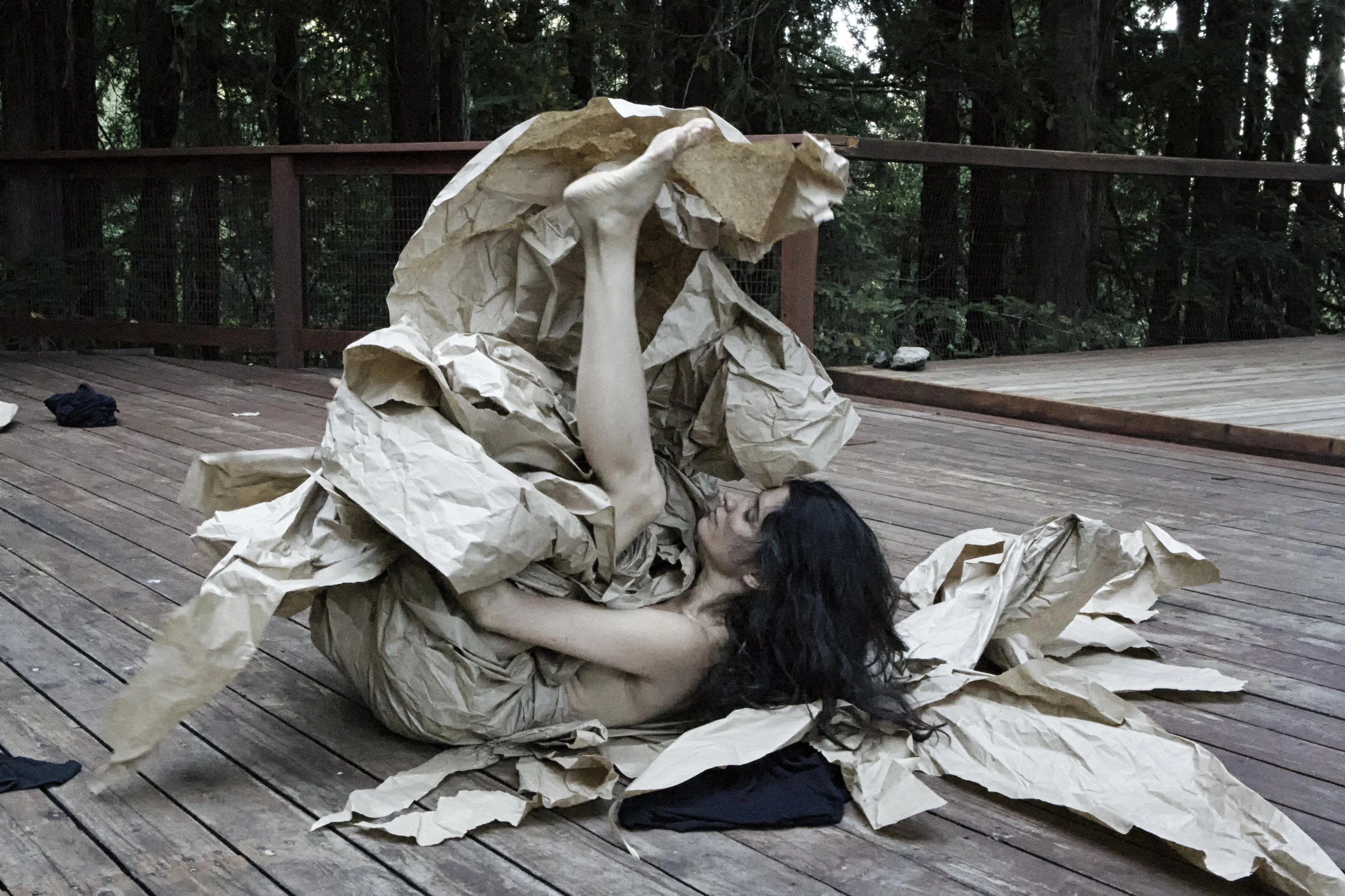 Janine Antoni in collaboration with Anna Halprin, Paper Dance , 2013. Rehearsal photographed by Pak Han at the Halprin Dance Deck © Janine Antoni; Courtesy of the artist and Luhring Augustine, New York