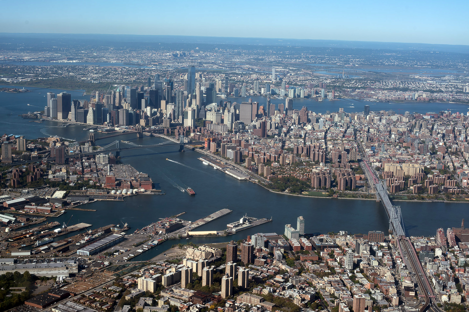It's always exciting to view the city from the airplane window as we approach JFK. Here you can see the three bridges spanning the East River from Brooklyn into Manhattan: Coming up from the Statue of Liberty, it's the Brooklyn Bridge, the Manhattan Bridge, and the Williamsburg Bridge. Just remember BMW and you'll always get the names in the right order!