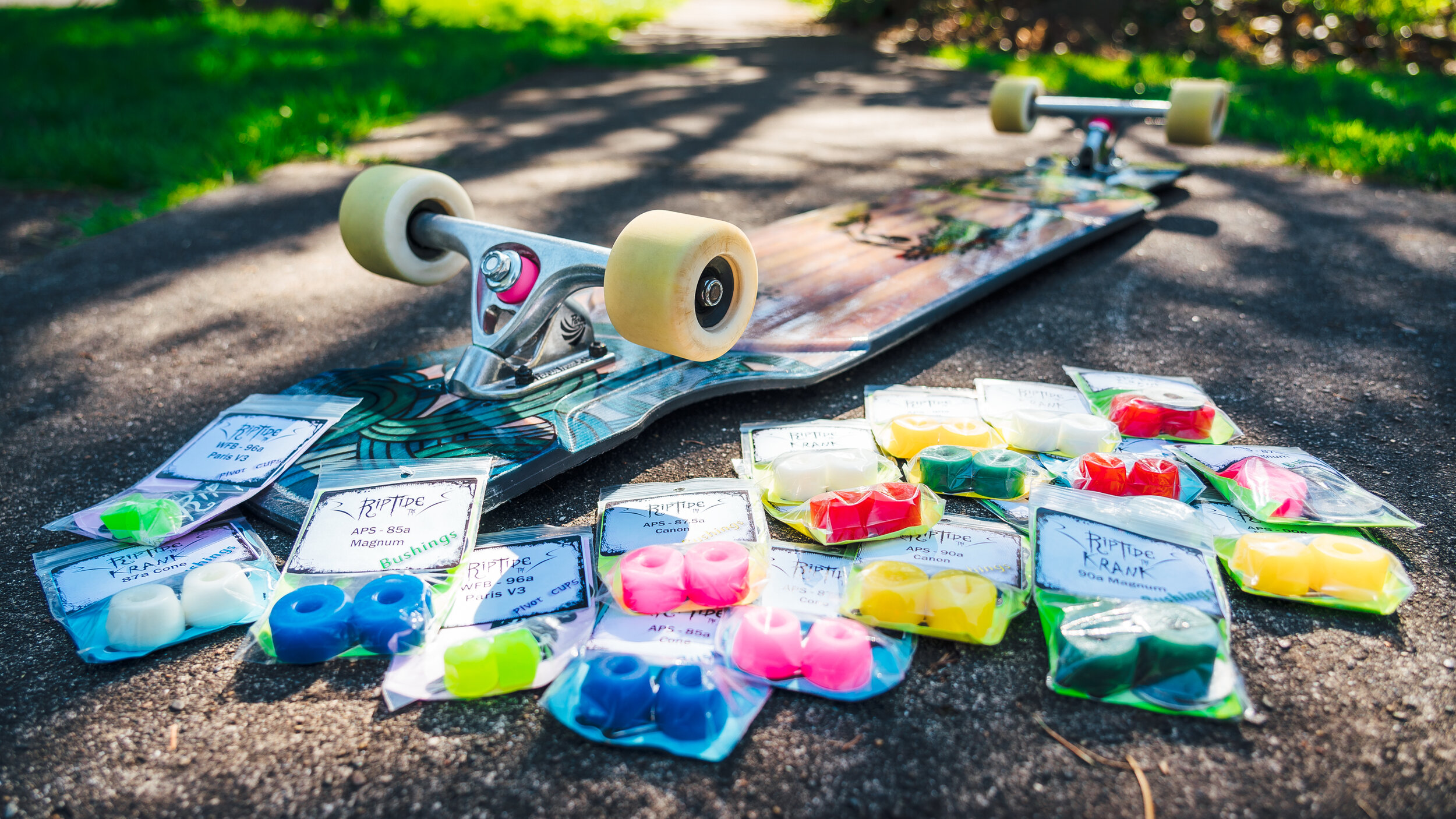 longboard surrounded by RipTide Bushings