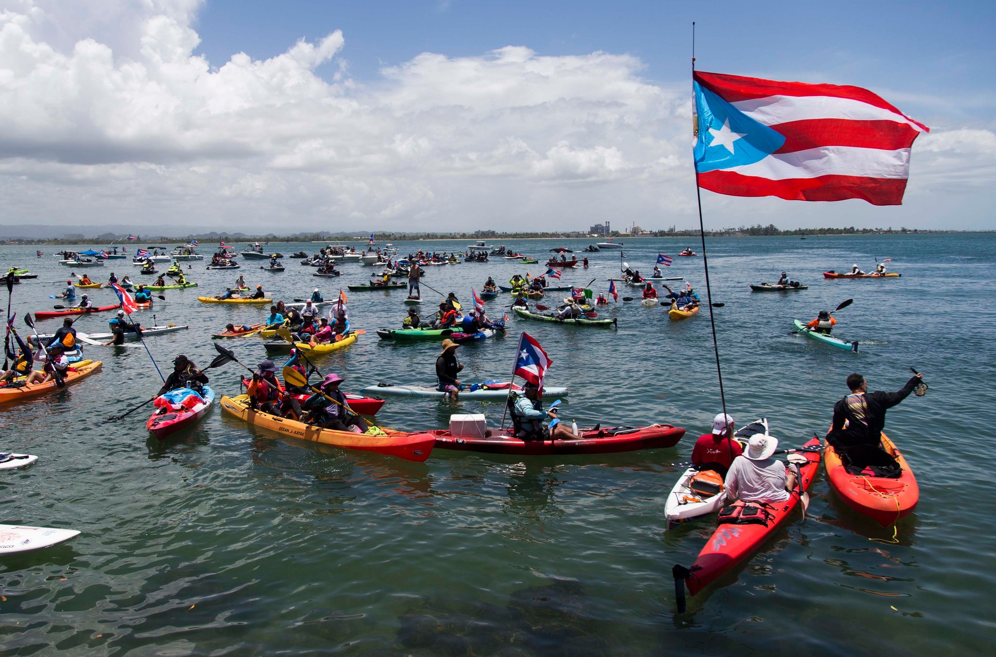 They boarded kayaks and water scooters