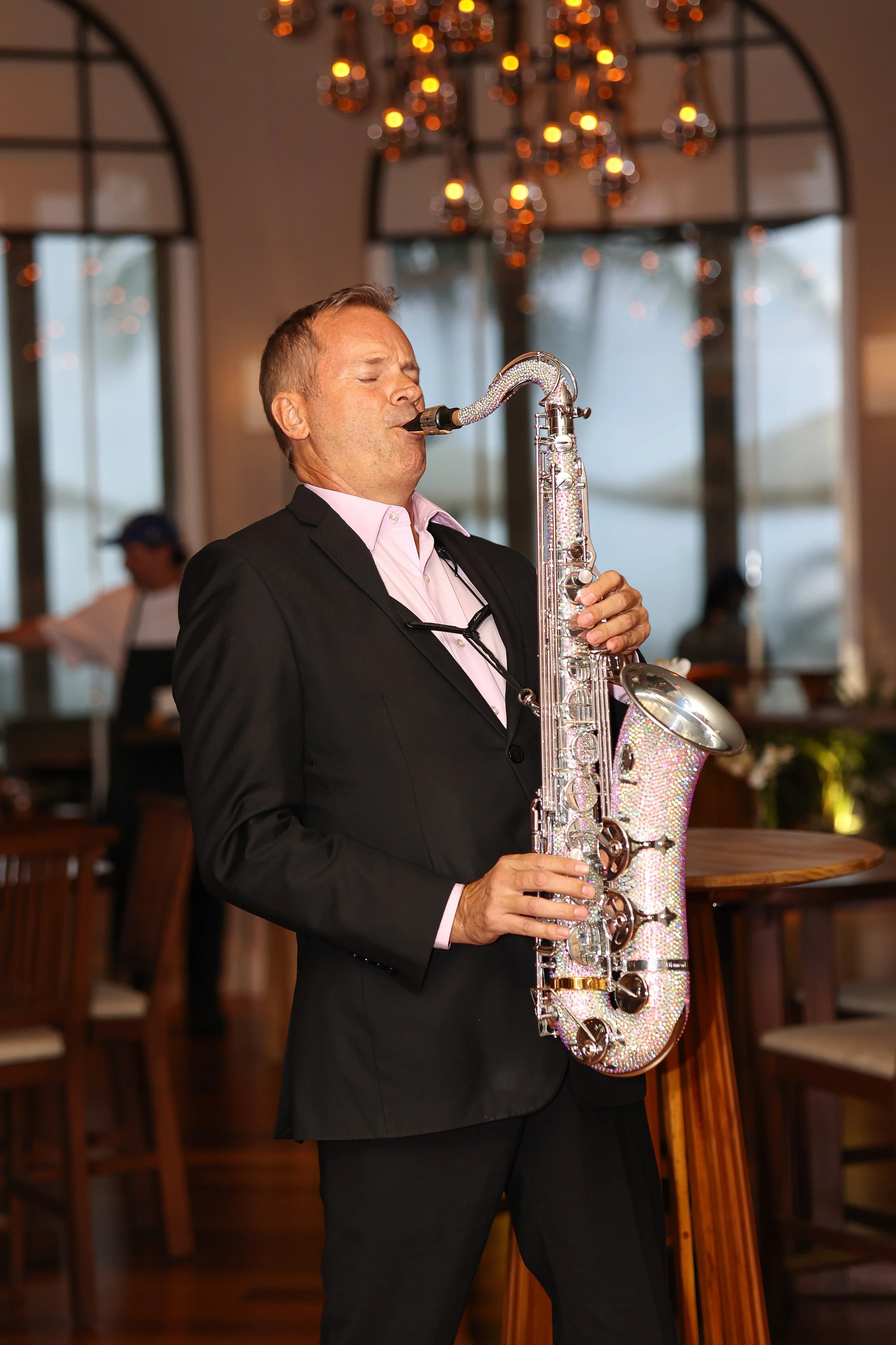 A saxophonist performing at Taste of Nobu Manalapan
