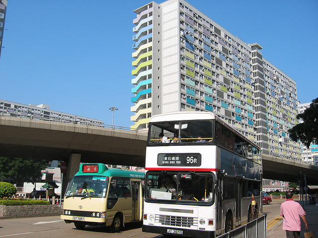 Private mini-bus beside public bus, Hong Kong. Photo: Flickr/Yuksing