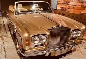 1968 Rolls Royce Silver Shadow drop top. If you show up to high school in one of these, trust me - people notice.