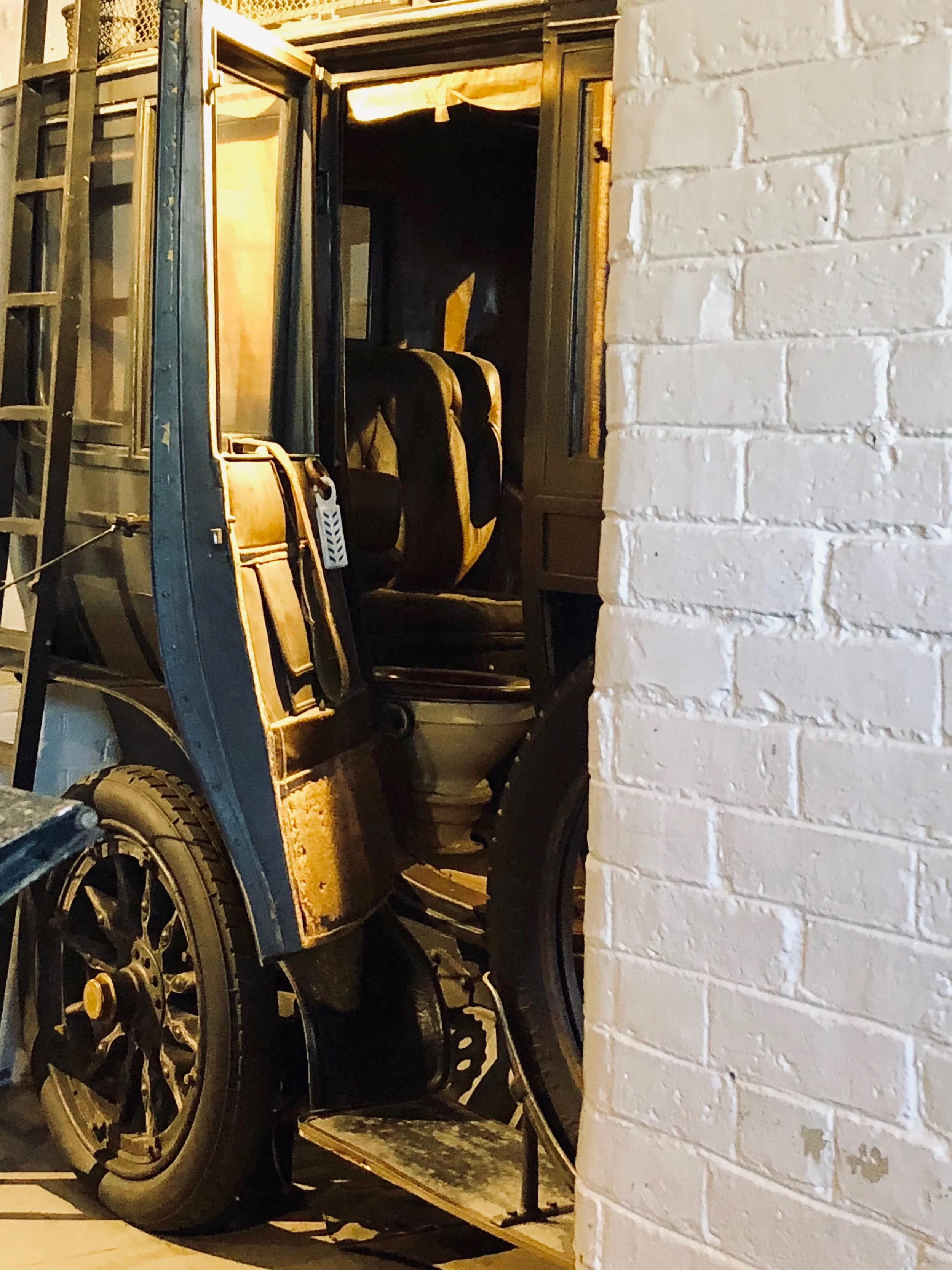 Yes. That’s a toilet in that 1906 Charron-Girodot-Voight. I particularly like the anachronistic but apropos air freshener clipped to the door.
