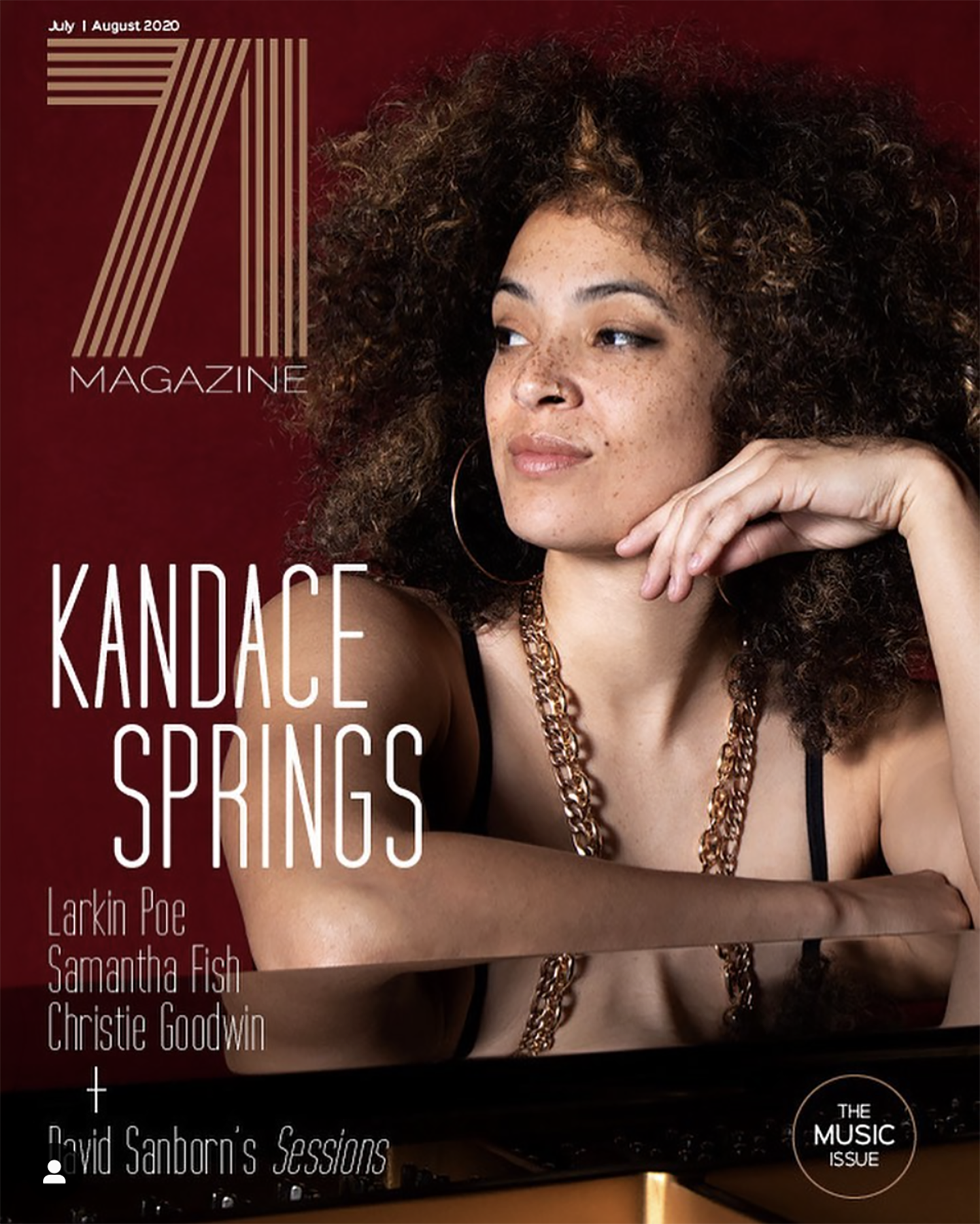 Cover of a magazine featuring a woman with curly hair, wearing large hoop earrings, a necklace, and a black top. The magazine is titled '7 Magazine' and the cover story is about 'Kandace Springs.' The issue is a music edition from July and August 202