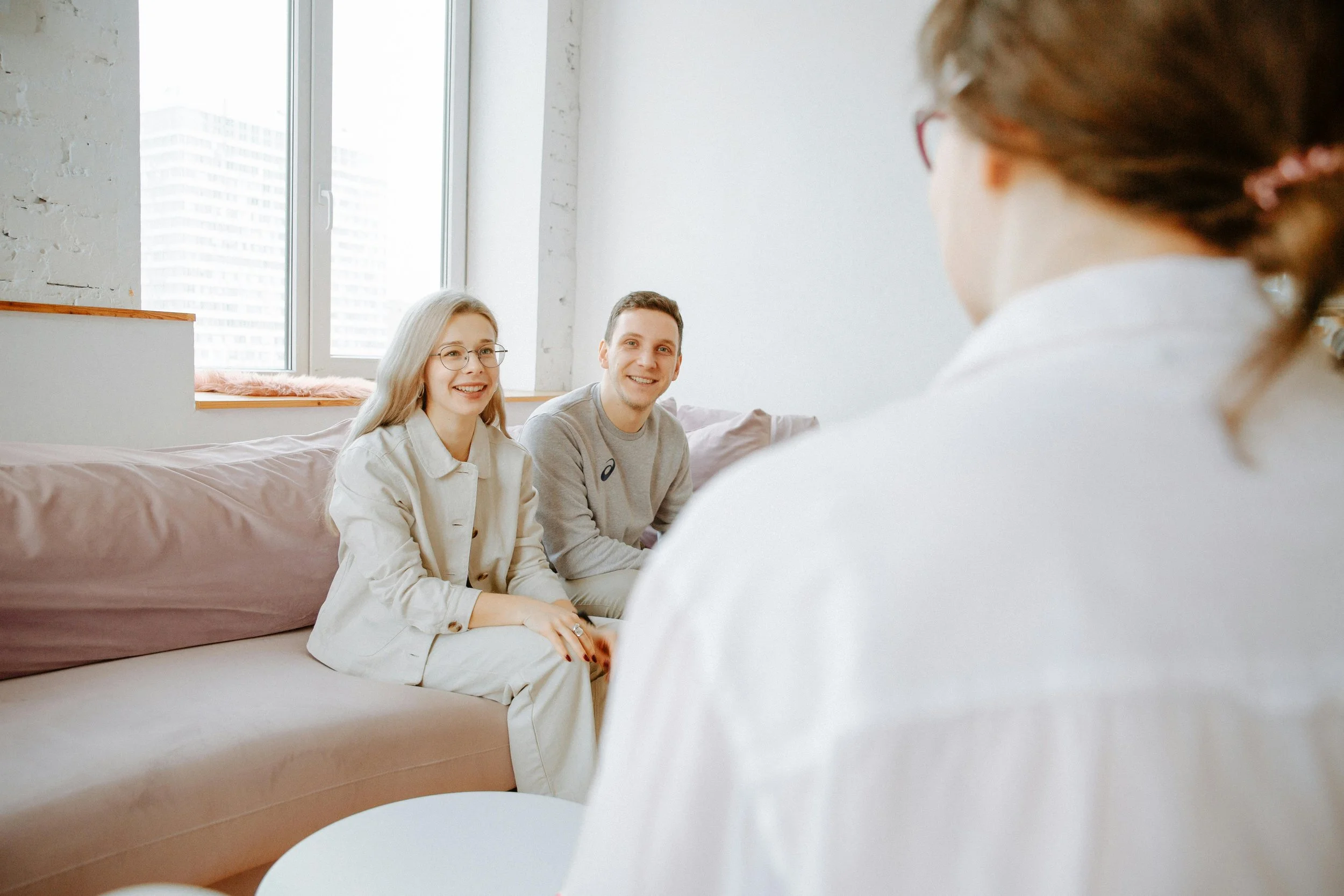 Couple smiling during a premarital counseling session in Austin