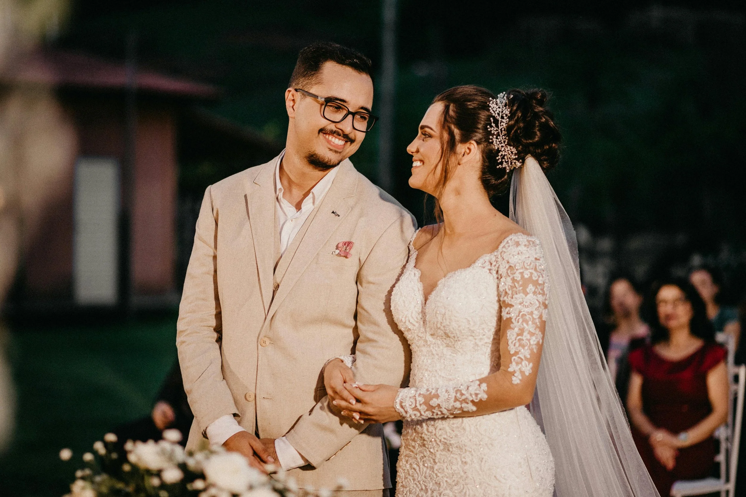 Recently married couple embracing after their wedding ceremony