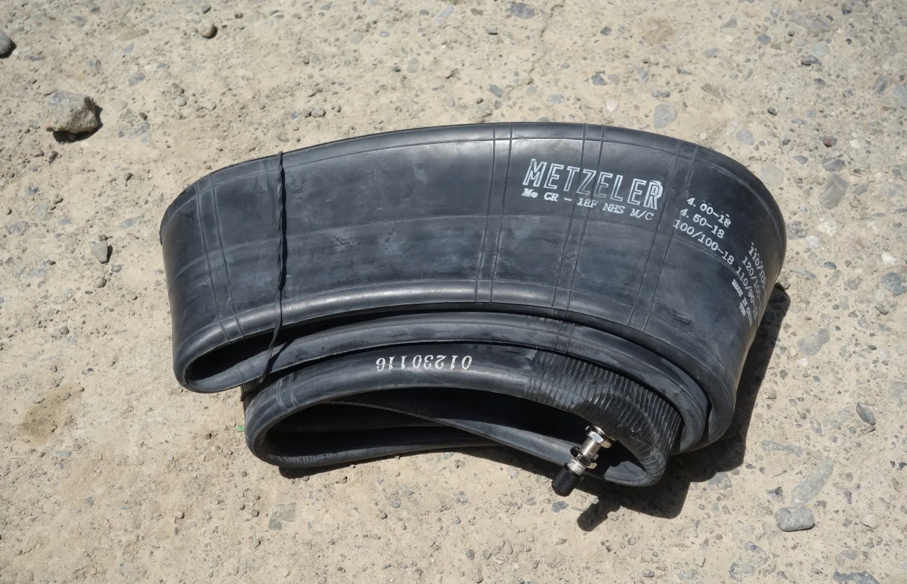 A regular spare tube. In case of a flat tire it is convenient to fit the spare one and repair the fitted heavy-duty-tube later.