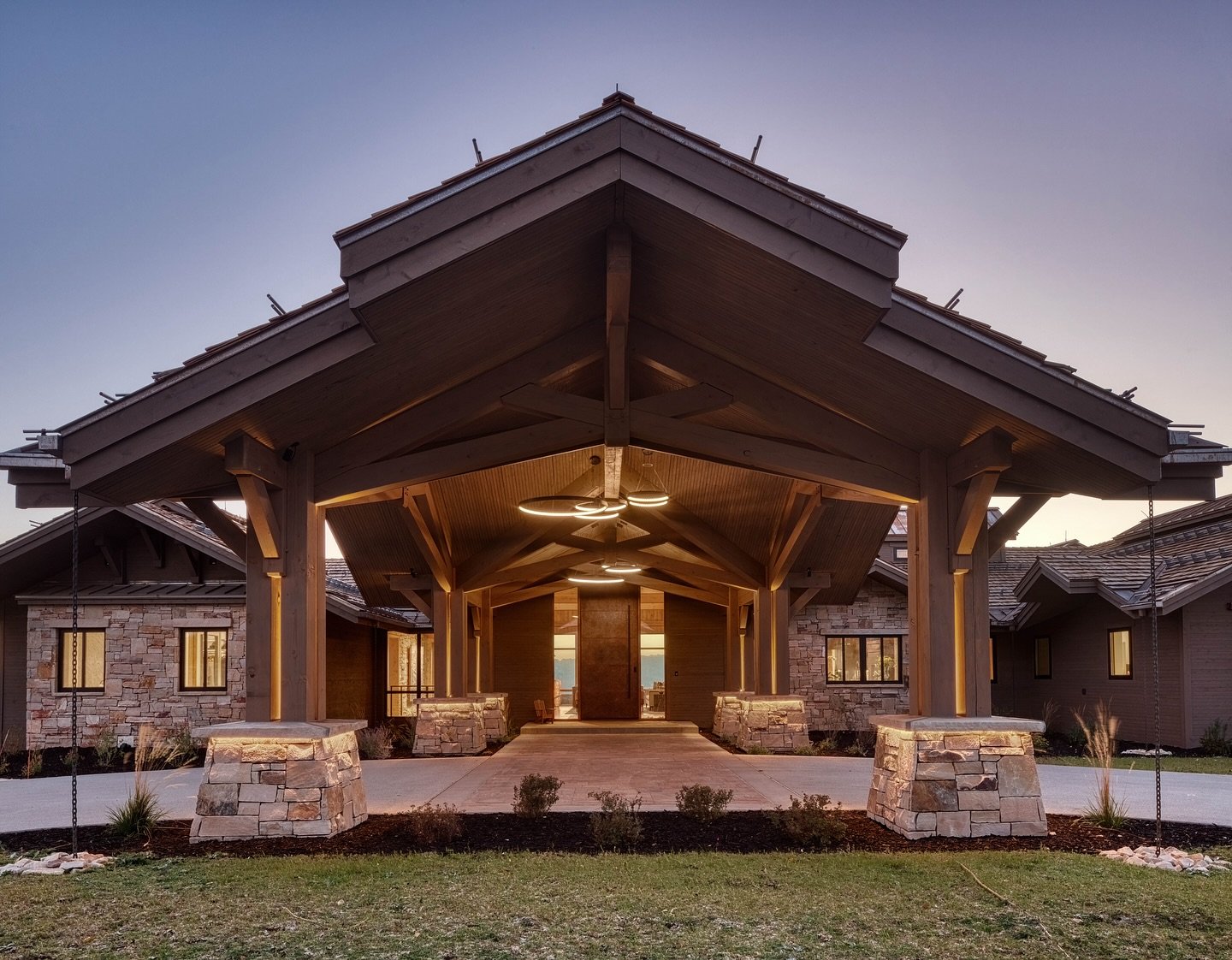 We love making a bold entrance. This dramatic timber framed porte coch&egrave;re is the perfect set up for welcoming you into this luxury vacation home. Structured with the same ICLT panels, stone, and timber framing used throughout the home it sets 