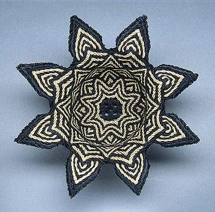 Mandala, 2004.  Cords made from perle cotton.  Single-course oblique twining (SCOT) with machine stitching around the “petals”.