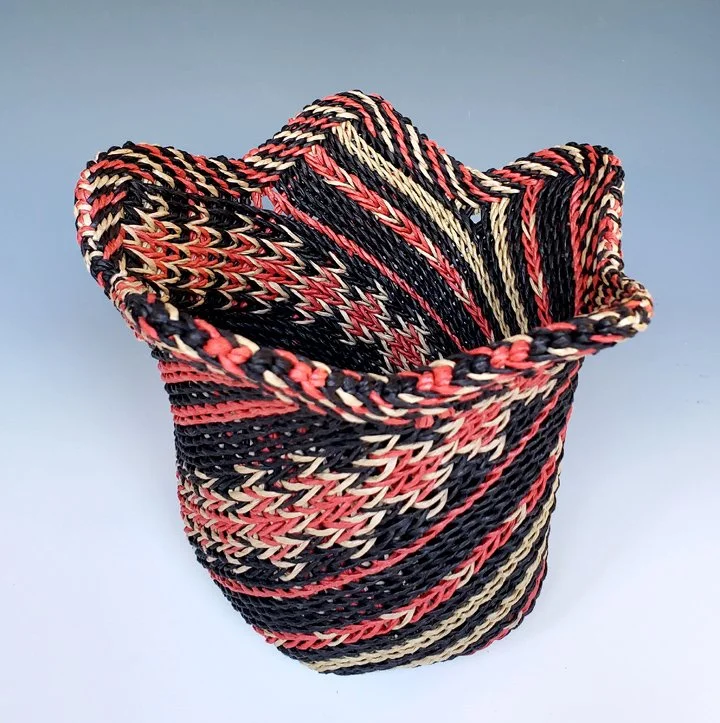 East Telemark #1, 2024.  Cords made from paper ribbon following a tablet-weaving threading diagram.