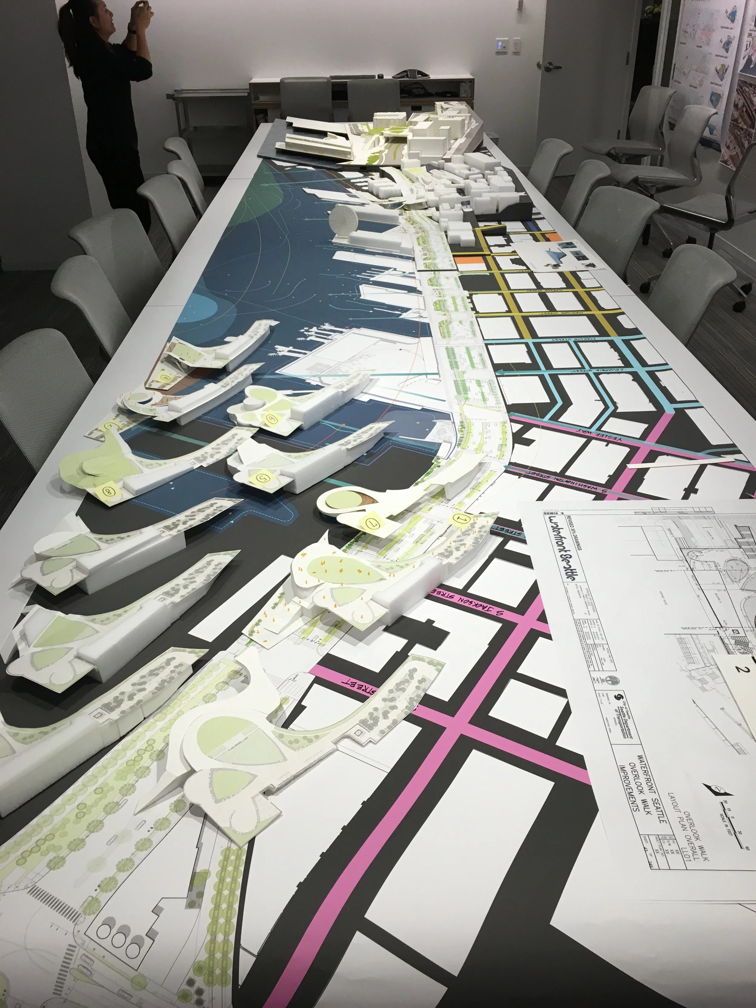  DEC 2016  Photo shows setup for a fundraising meeting. The 1'=1/16" site model overlaid on a map, demonstrating how our future aquarium will integrate with James Corner Field Operation's vision of Seattle waterfront. The series of objects on left ar